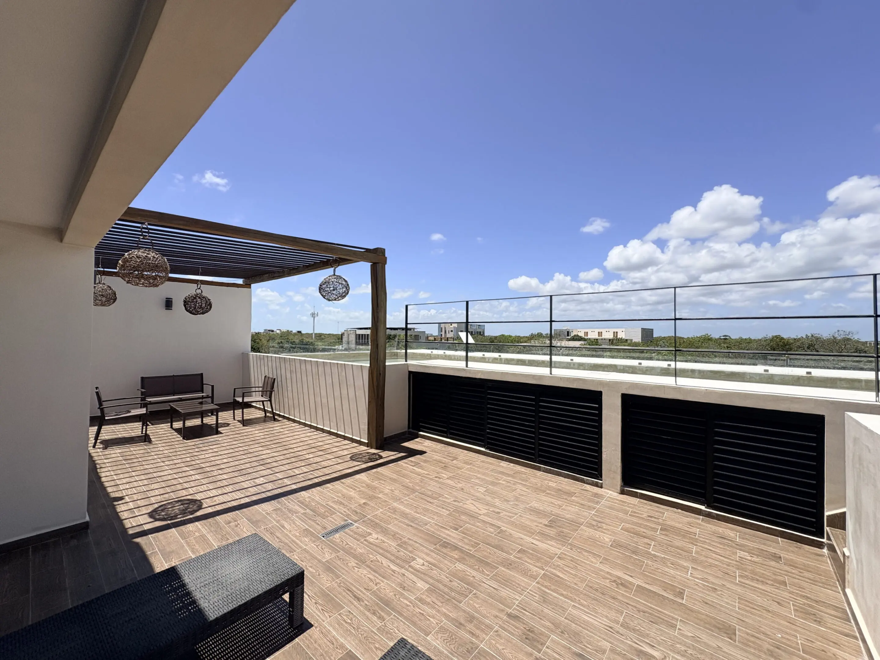Rooftop terrace with seating and pergola