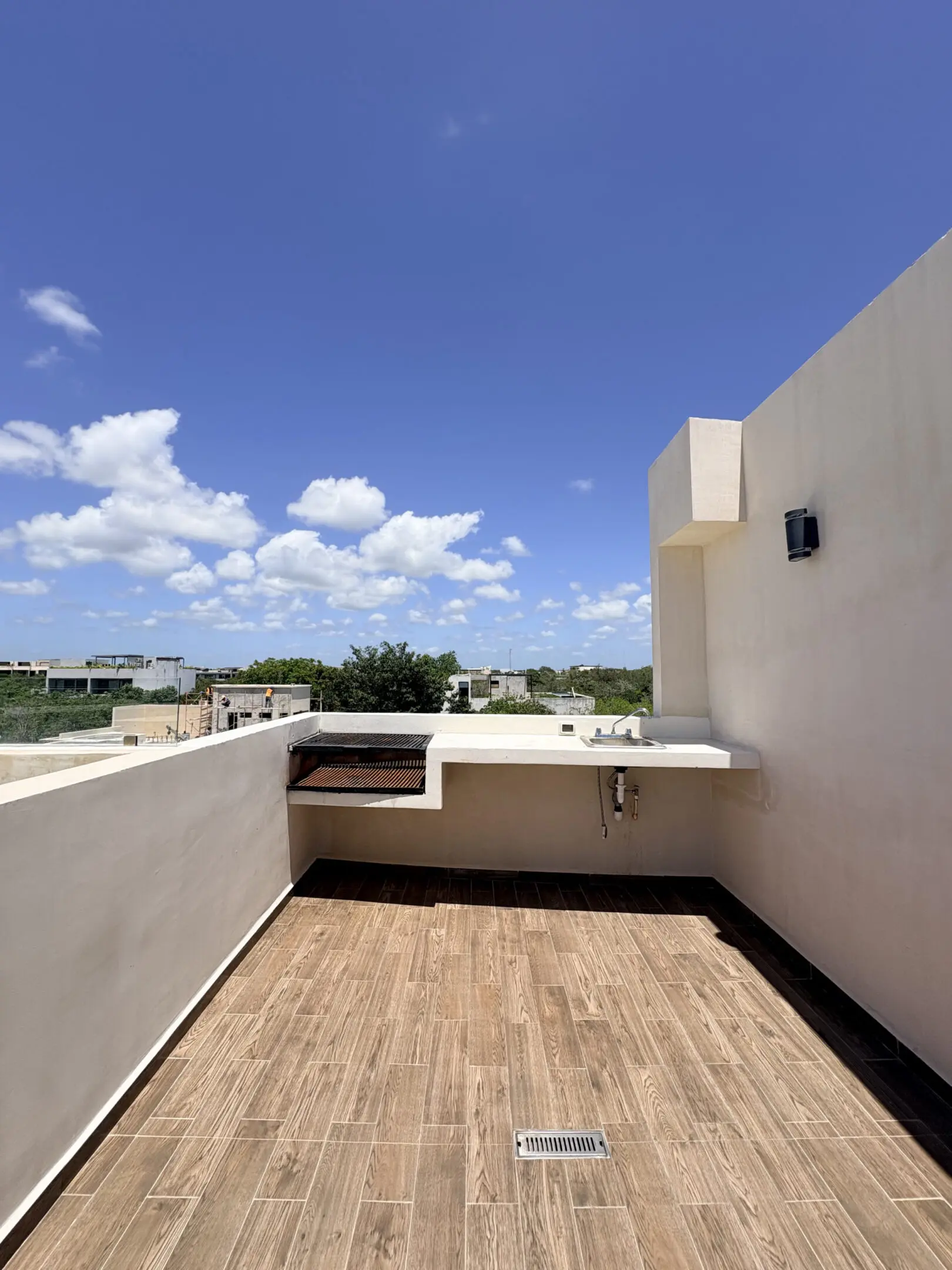 Rooftop terrace with built-in grill and sink