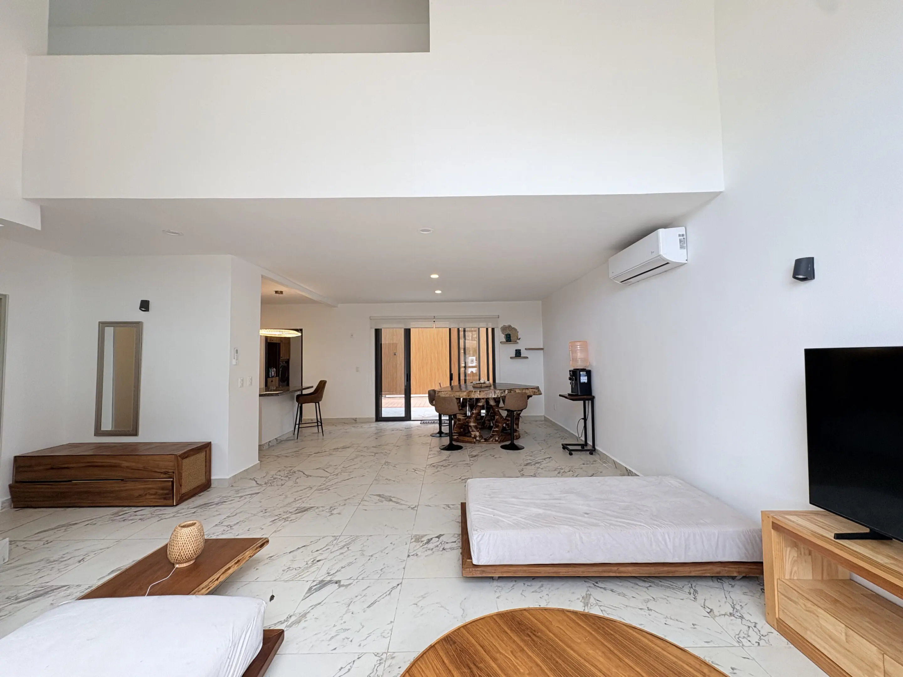 Spacious minimalist living room with dining area