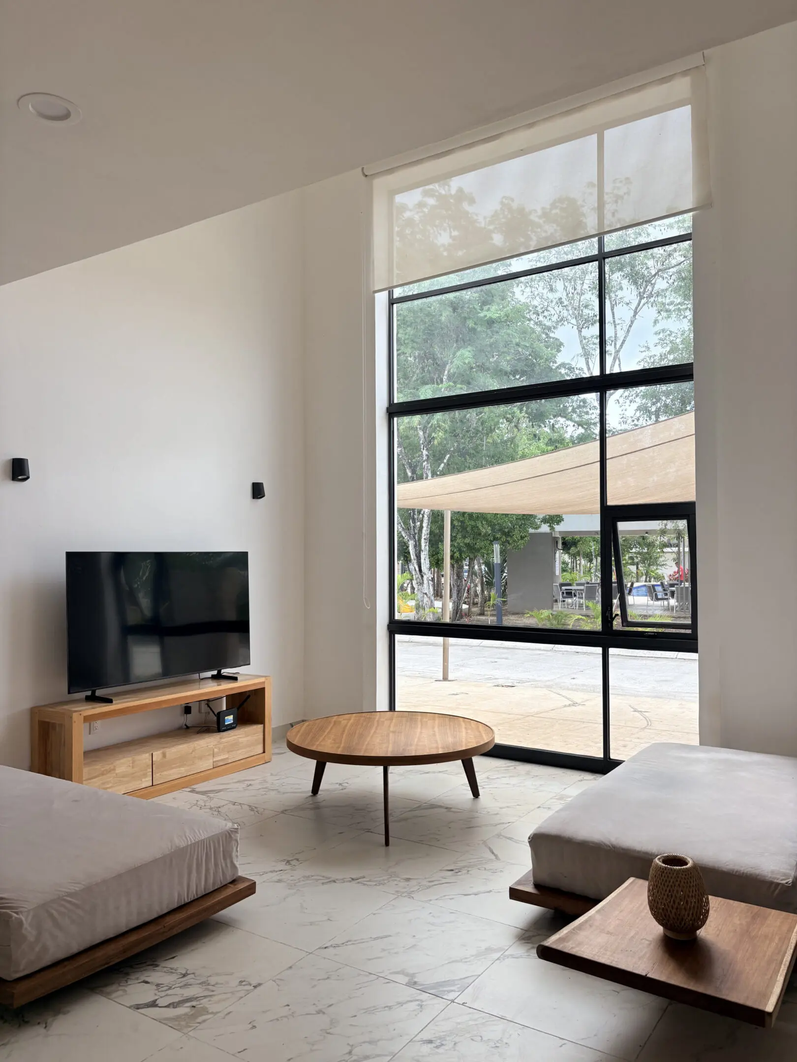 Bright modern living room with large window