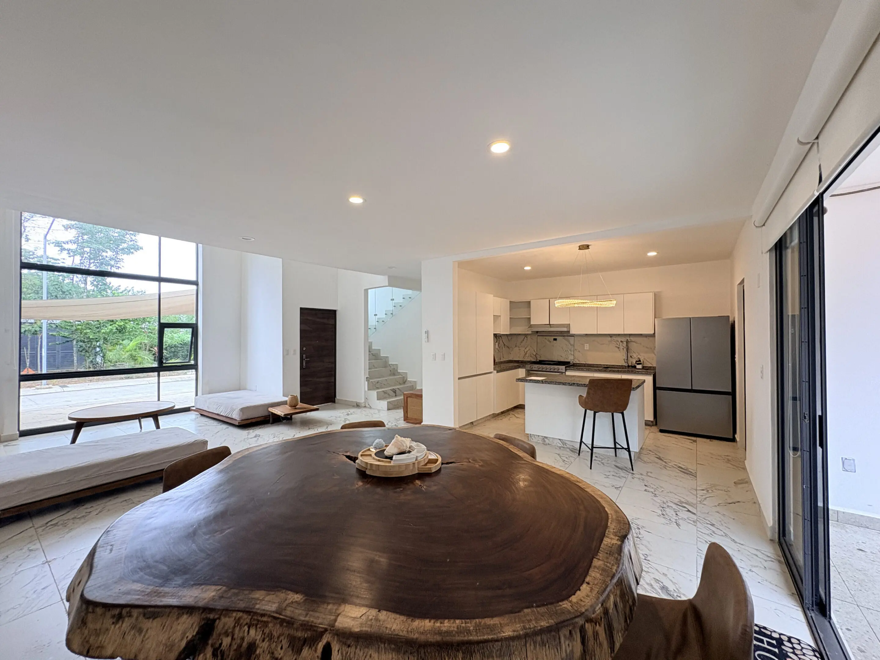 Open-plan living space with large live-edge table