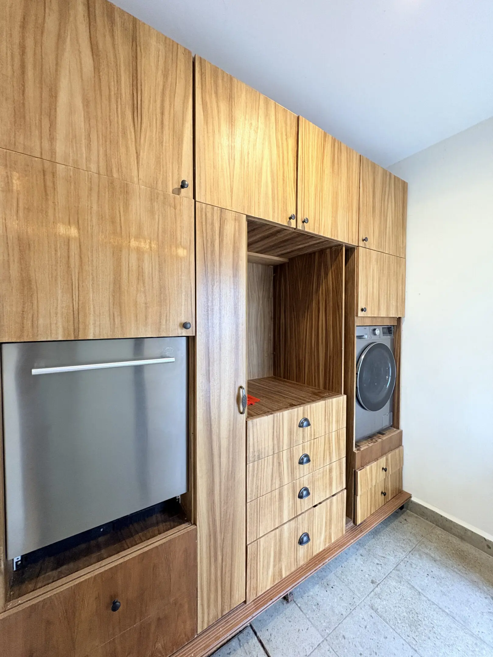 Built-in wood laundry cabinets with washer and dryer