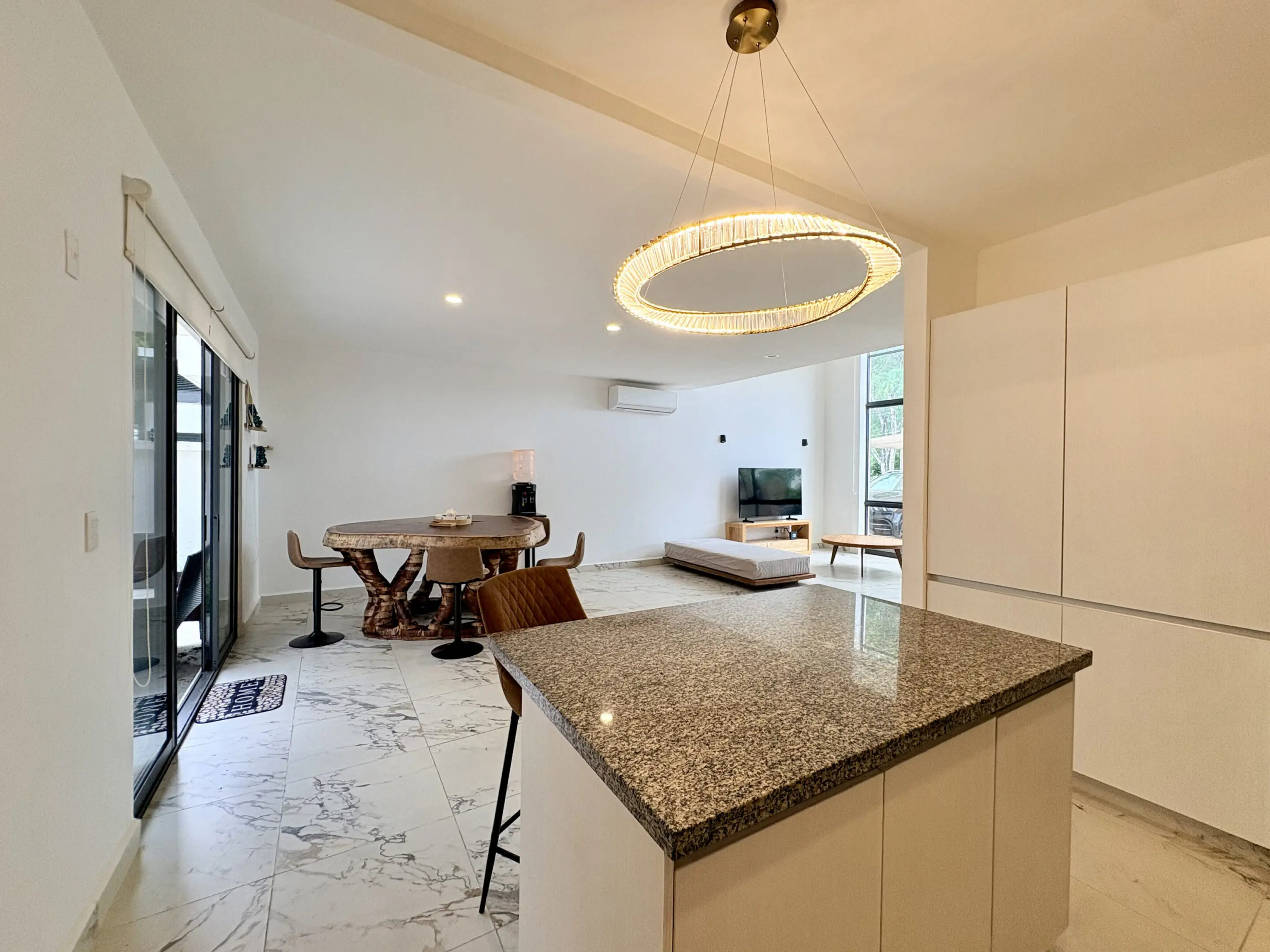 Modern open-plan kitchen with island and dining