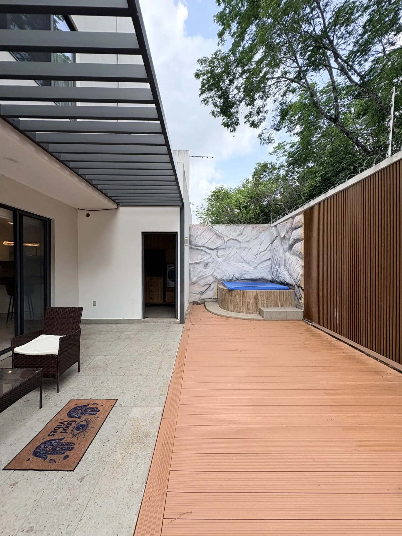 Modern patio with wooden deck and hot tub