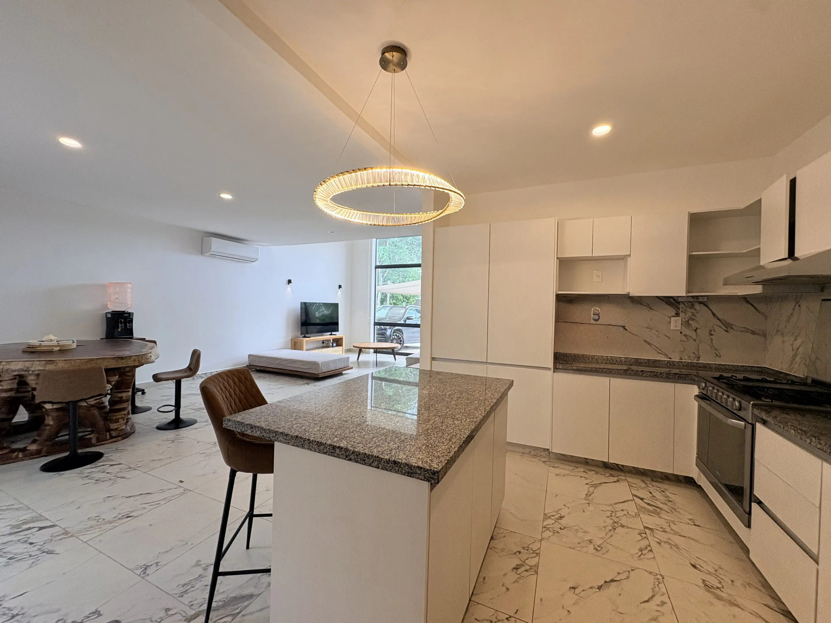 Modern open kitchen with island and marble floors