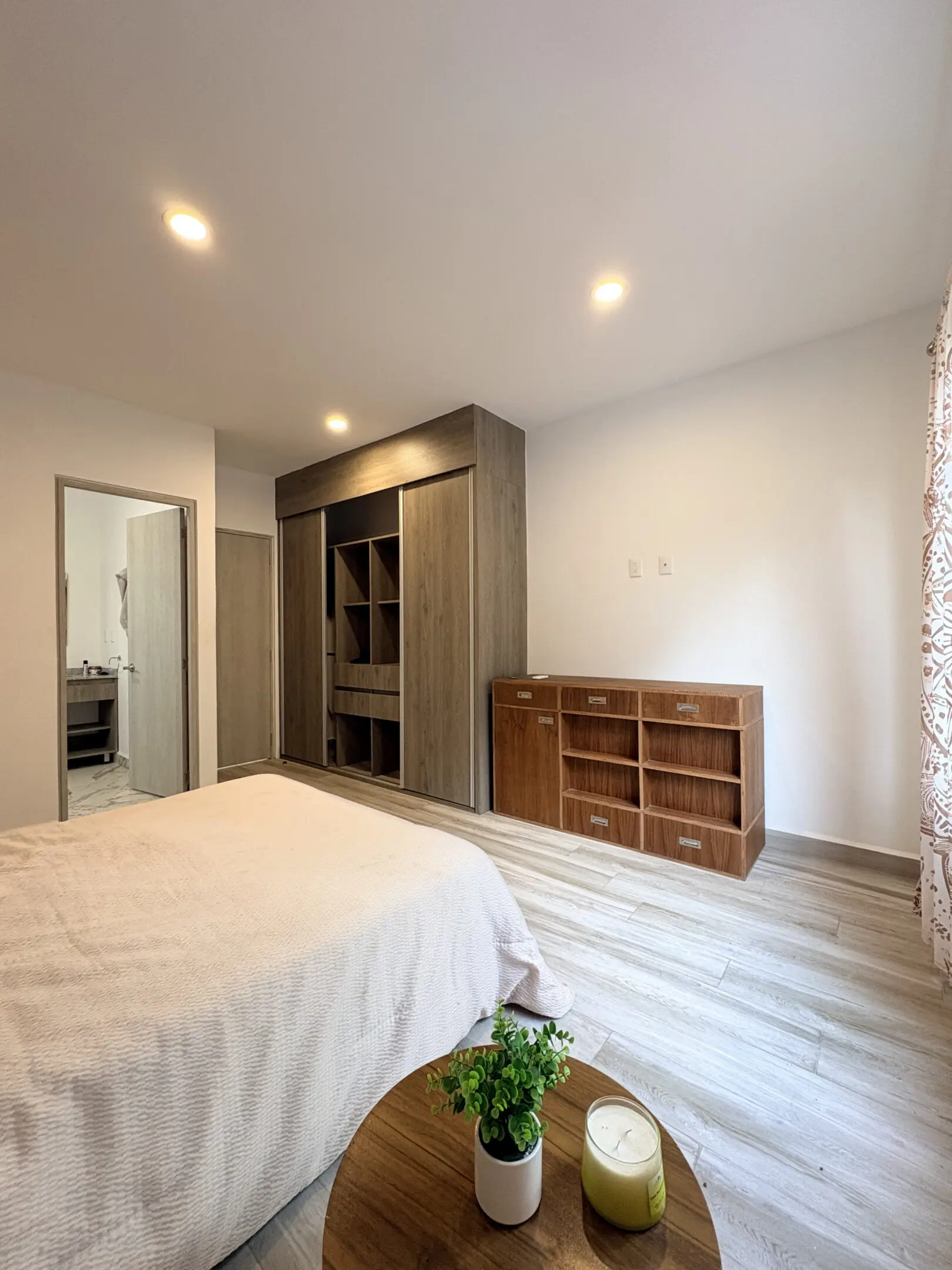 Bright modern bedroom with built-in wardrobe