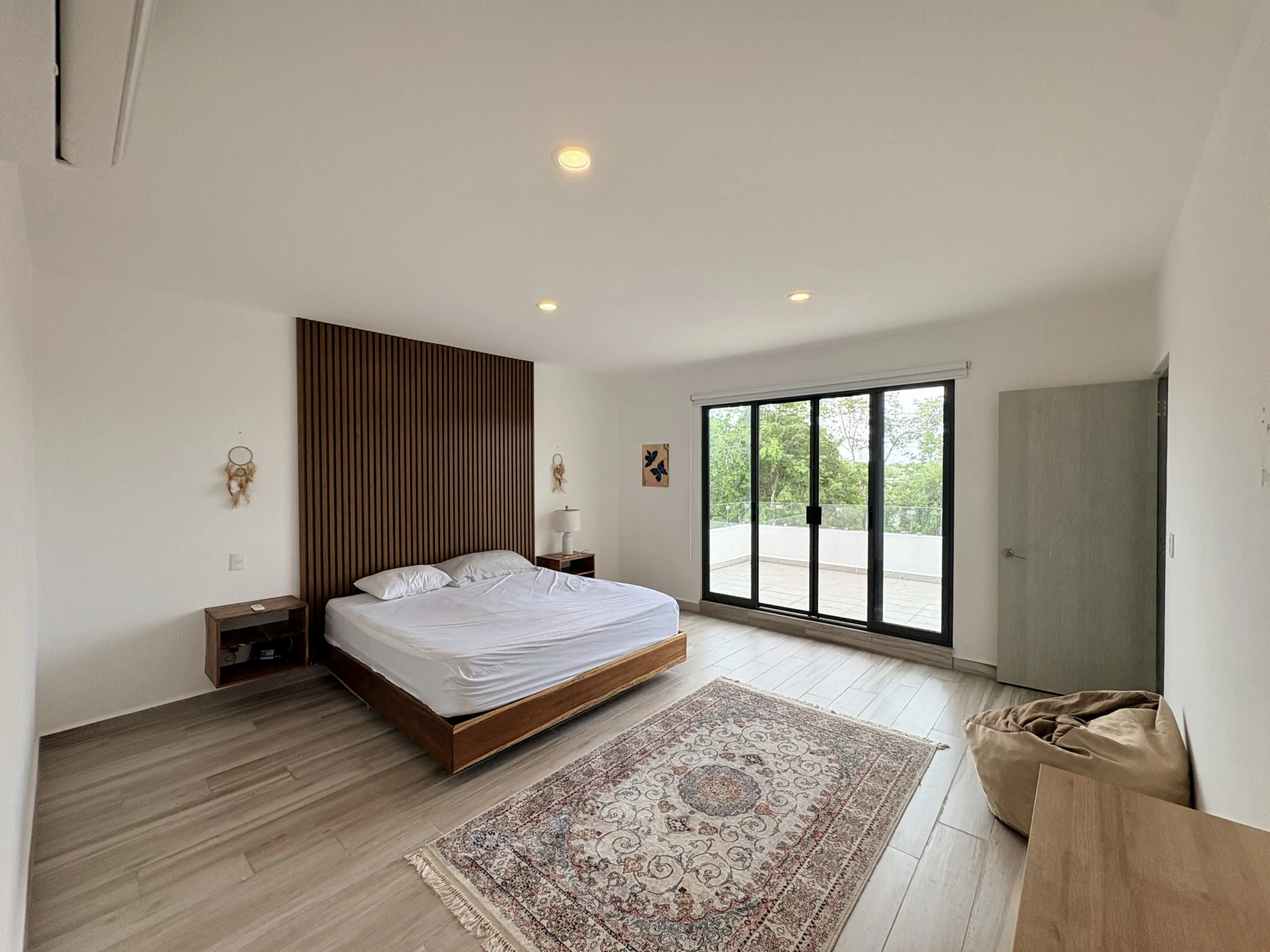 Minimalist bedroom with platform bed and sliding doors