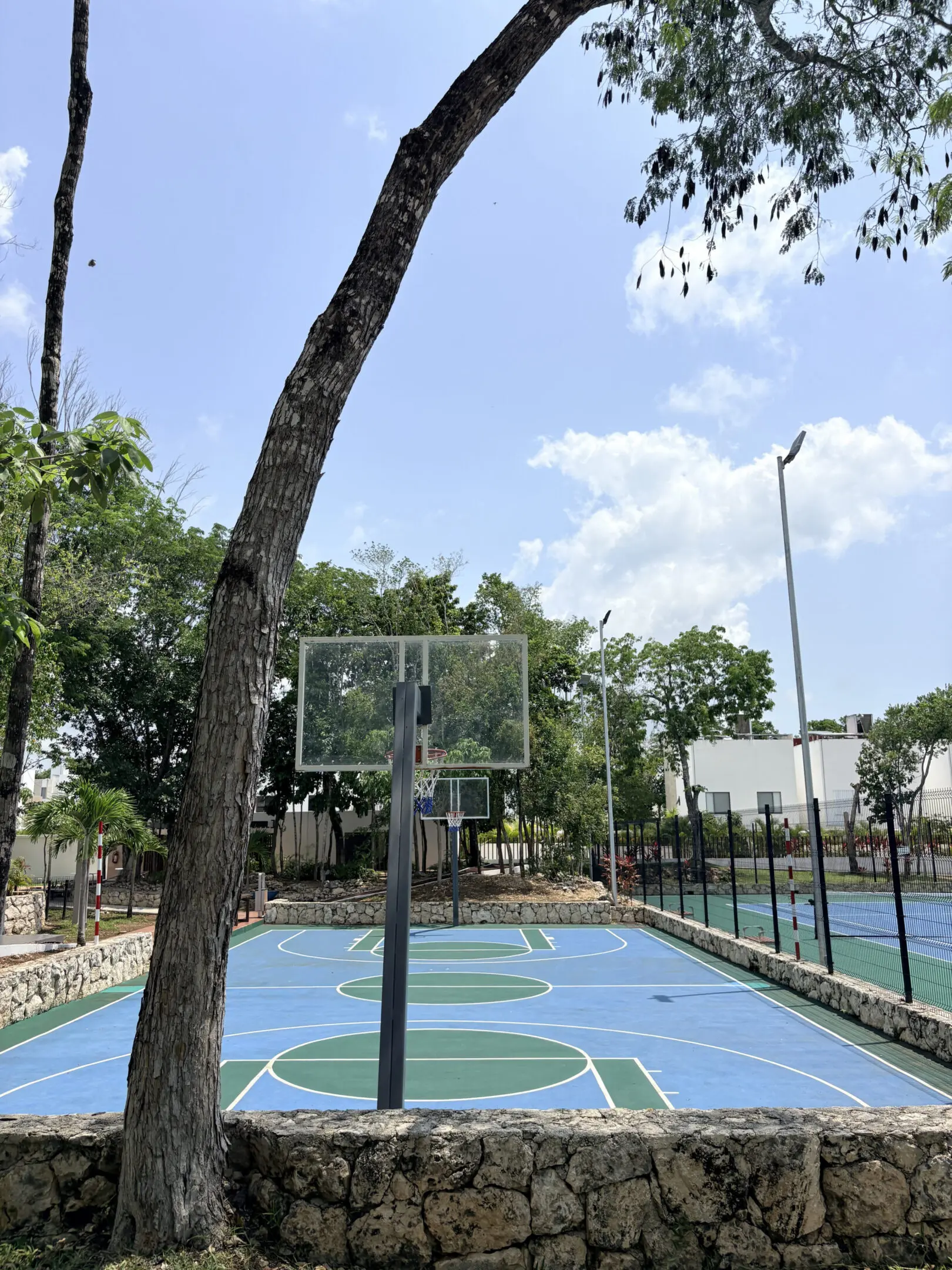 Empty blue and green outdoor basketball court