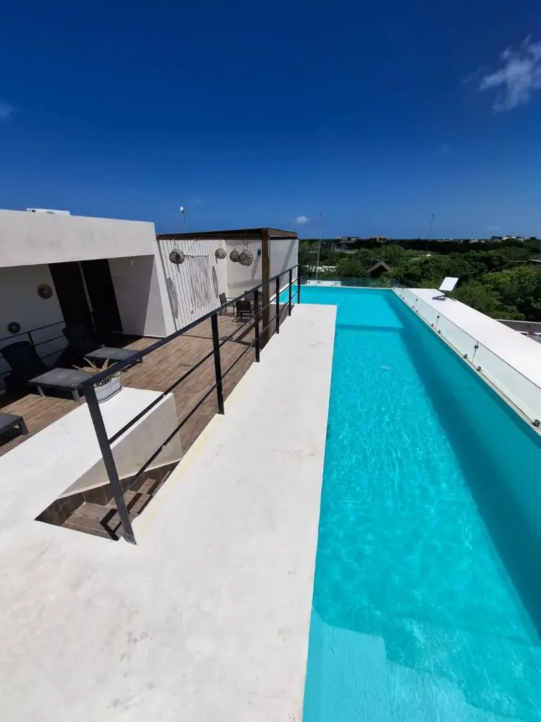 Rooftop infinity pool with terrace seating