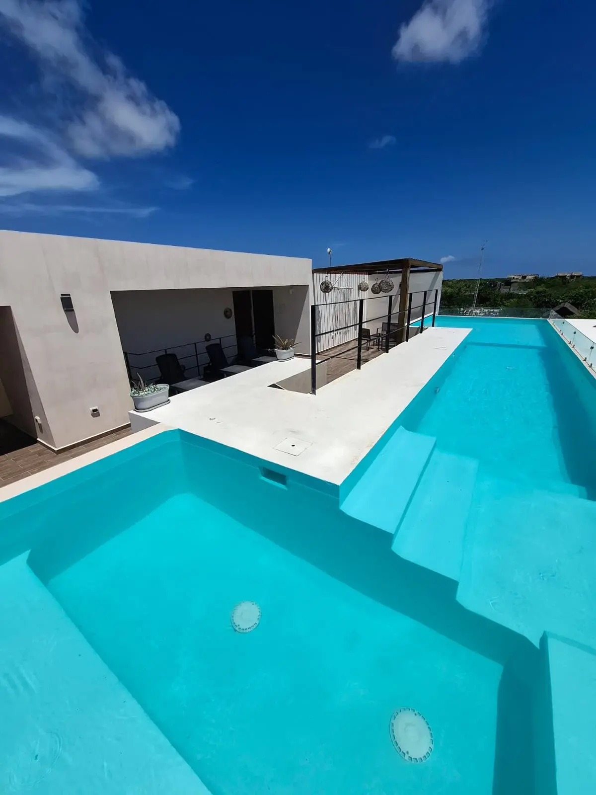 Modern rooftop pool with lounge area