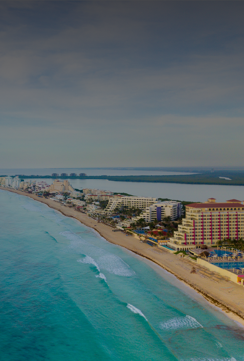 Aerial view of beachfront cityscape and ocean.