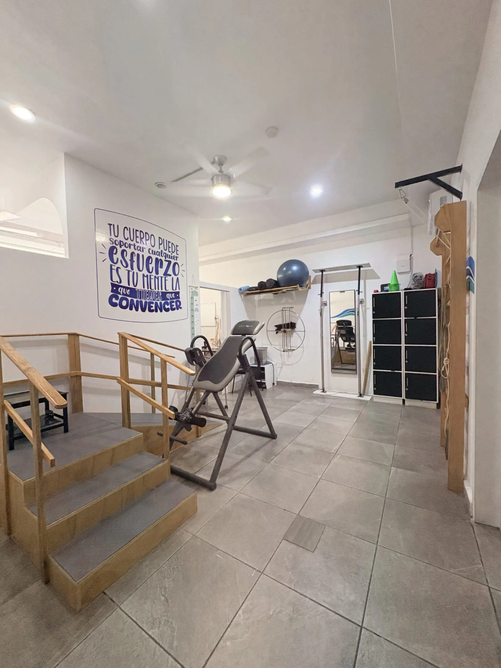 Home gym with inversion table and exercise ball