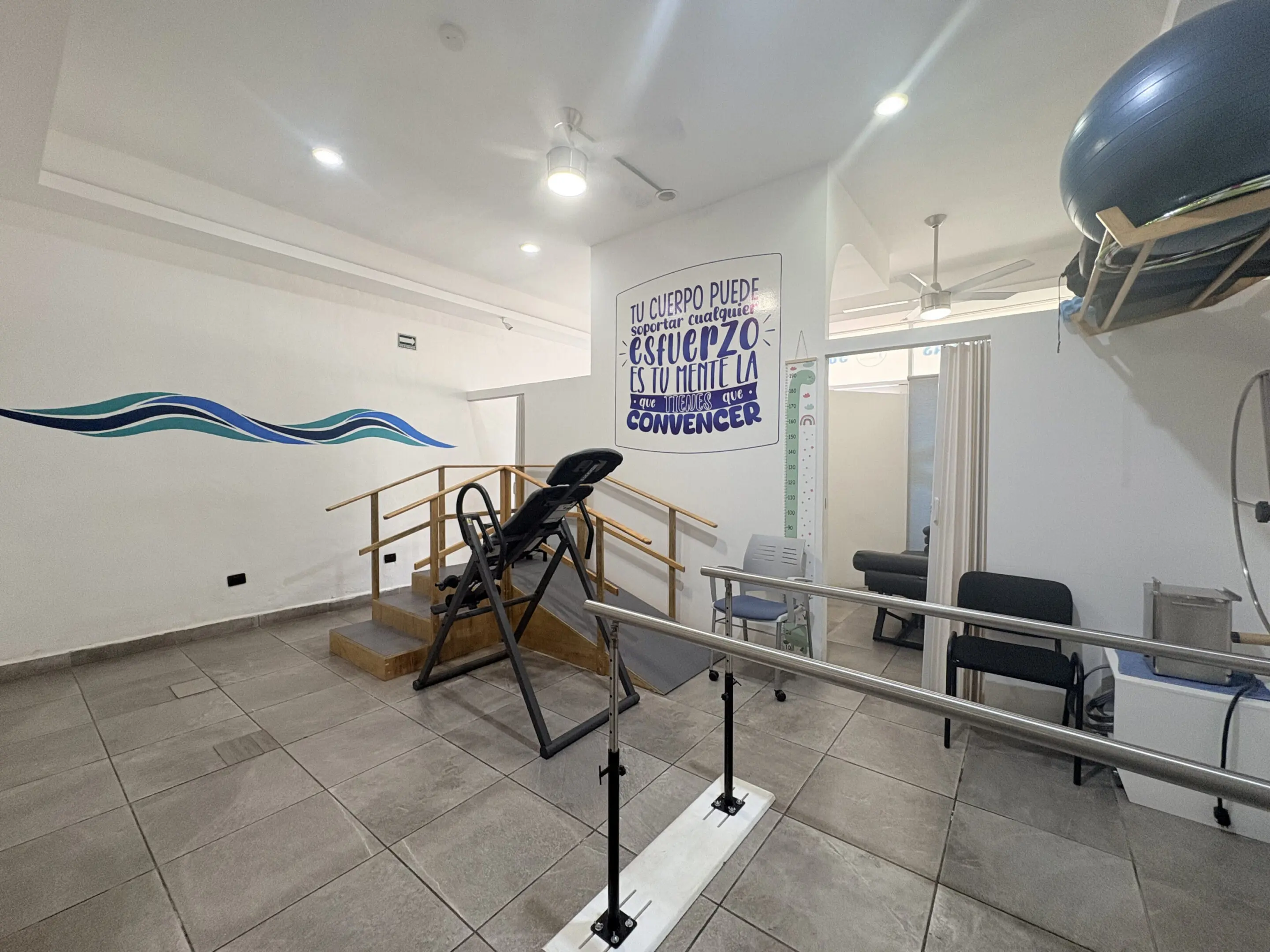 Physical therapy room with parallel bars