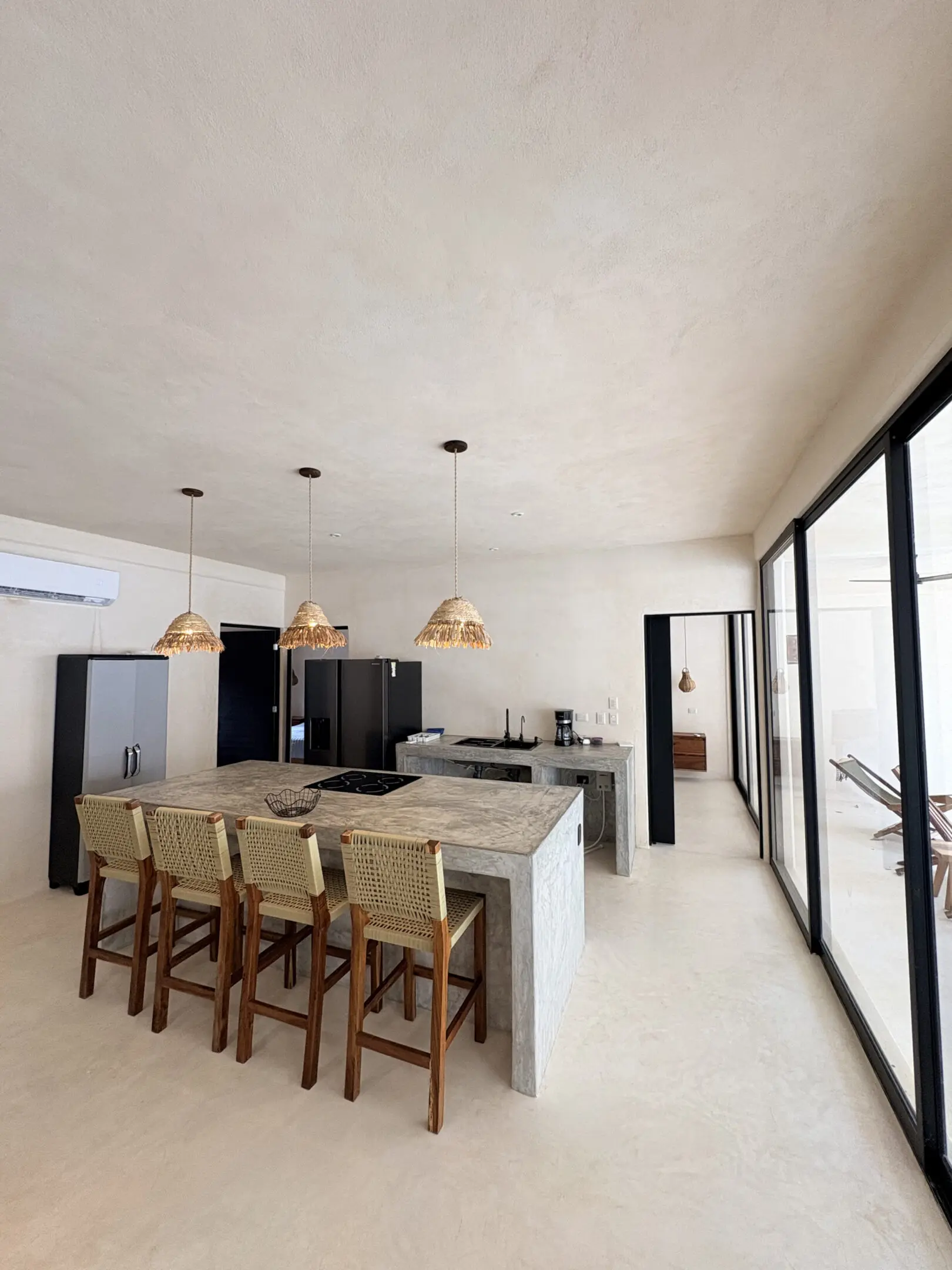 Modern kitchen island with four woven stools