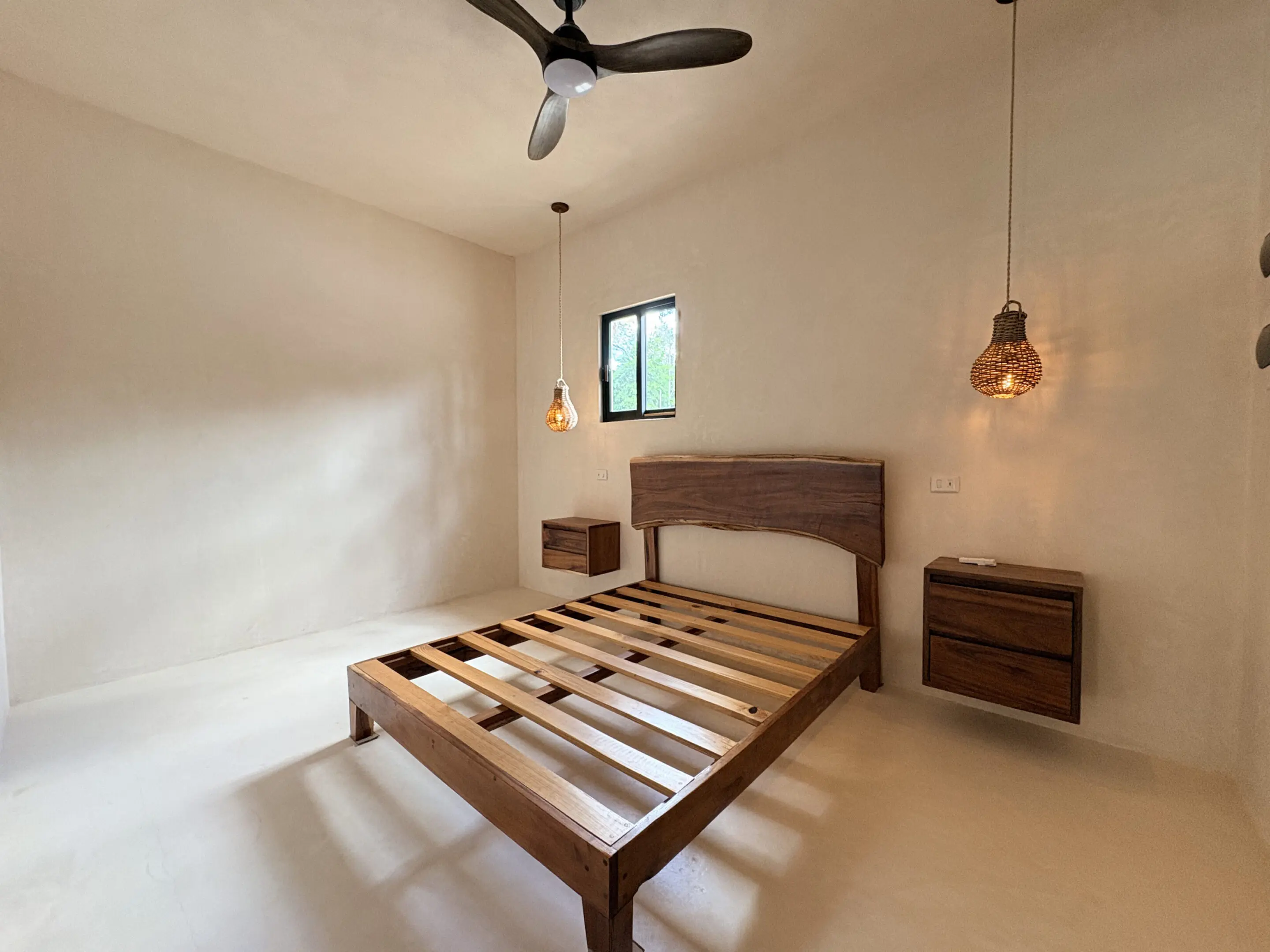 Minimalist bedroom with wooden bed frame, pendant lights