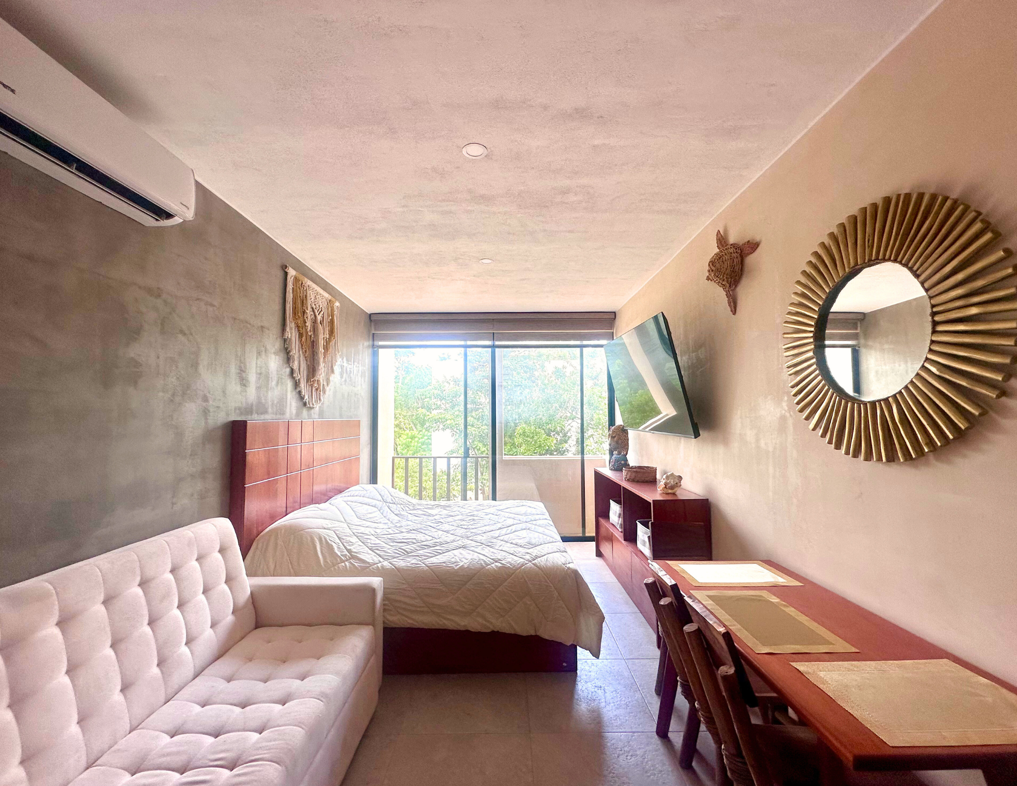 Modern studio bedroom with balcony and sofa