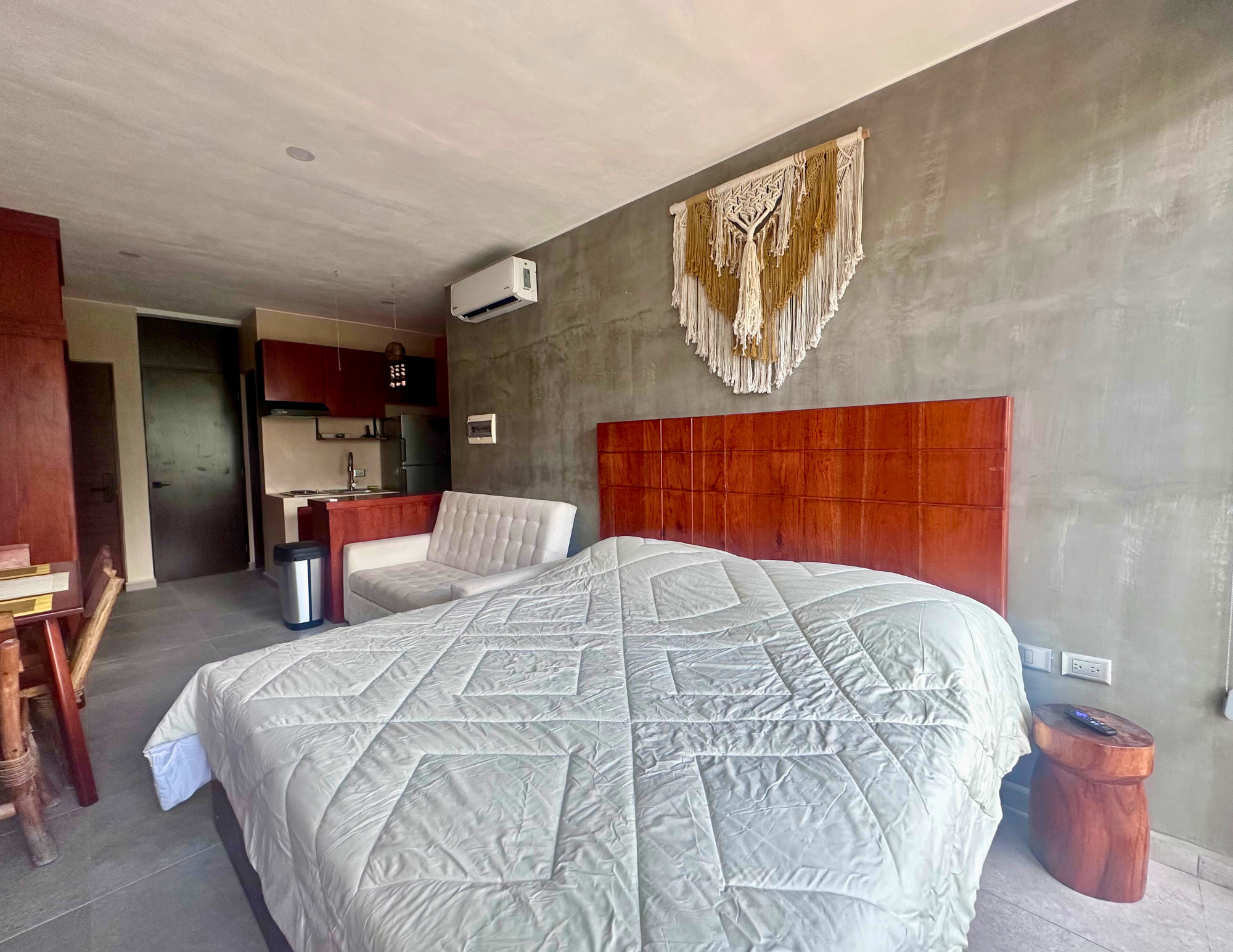 Modern studio bedroom with macrame wall hanging