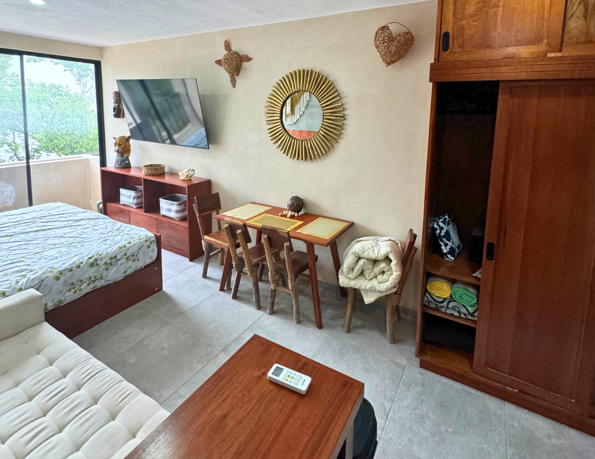 Cozy studio apartment with bed and dining table