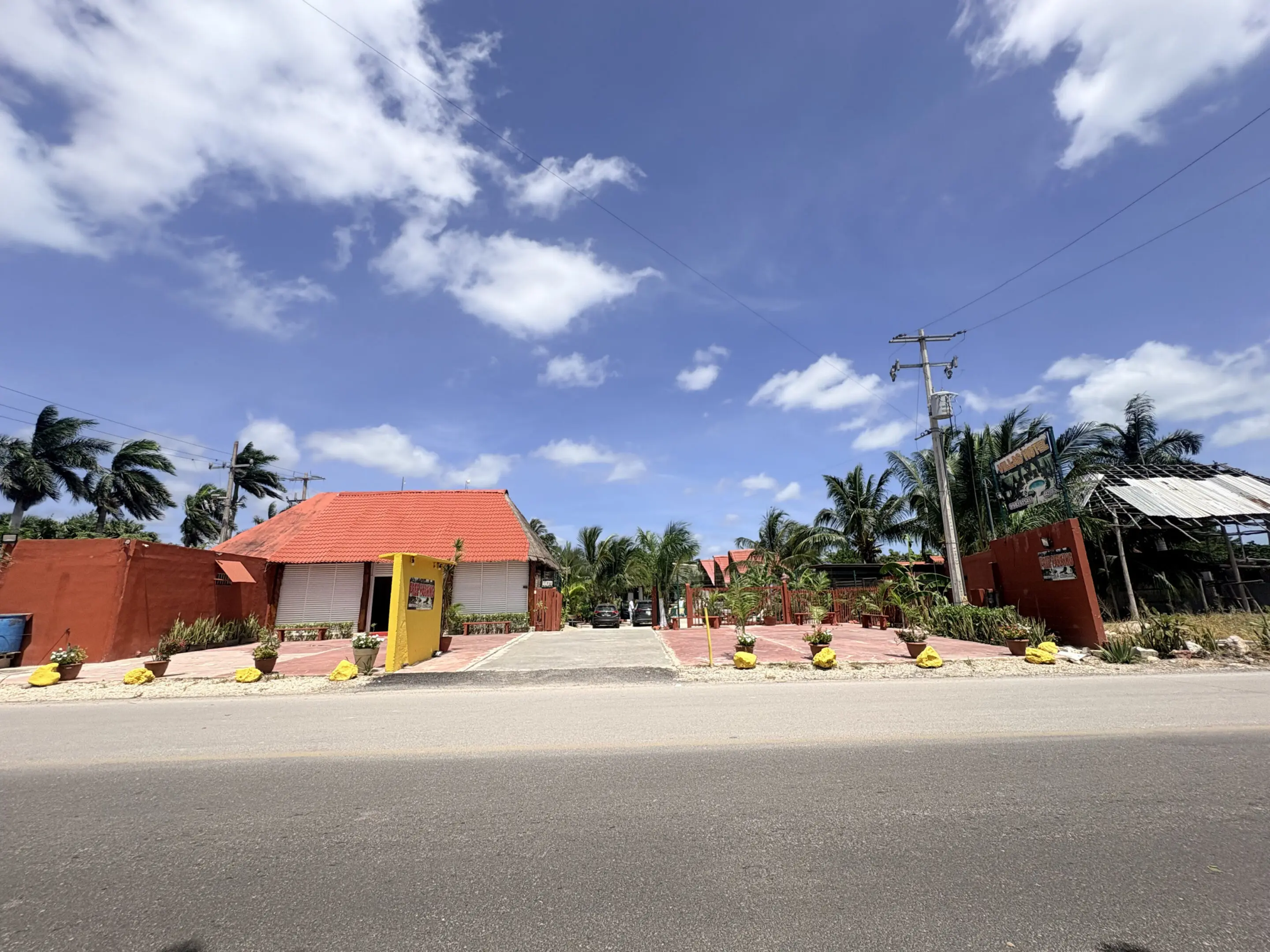 Tropical roadside property with red roof
