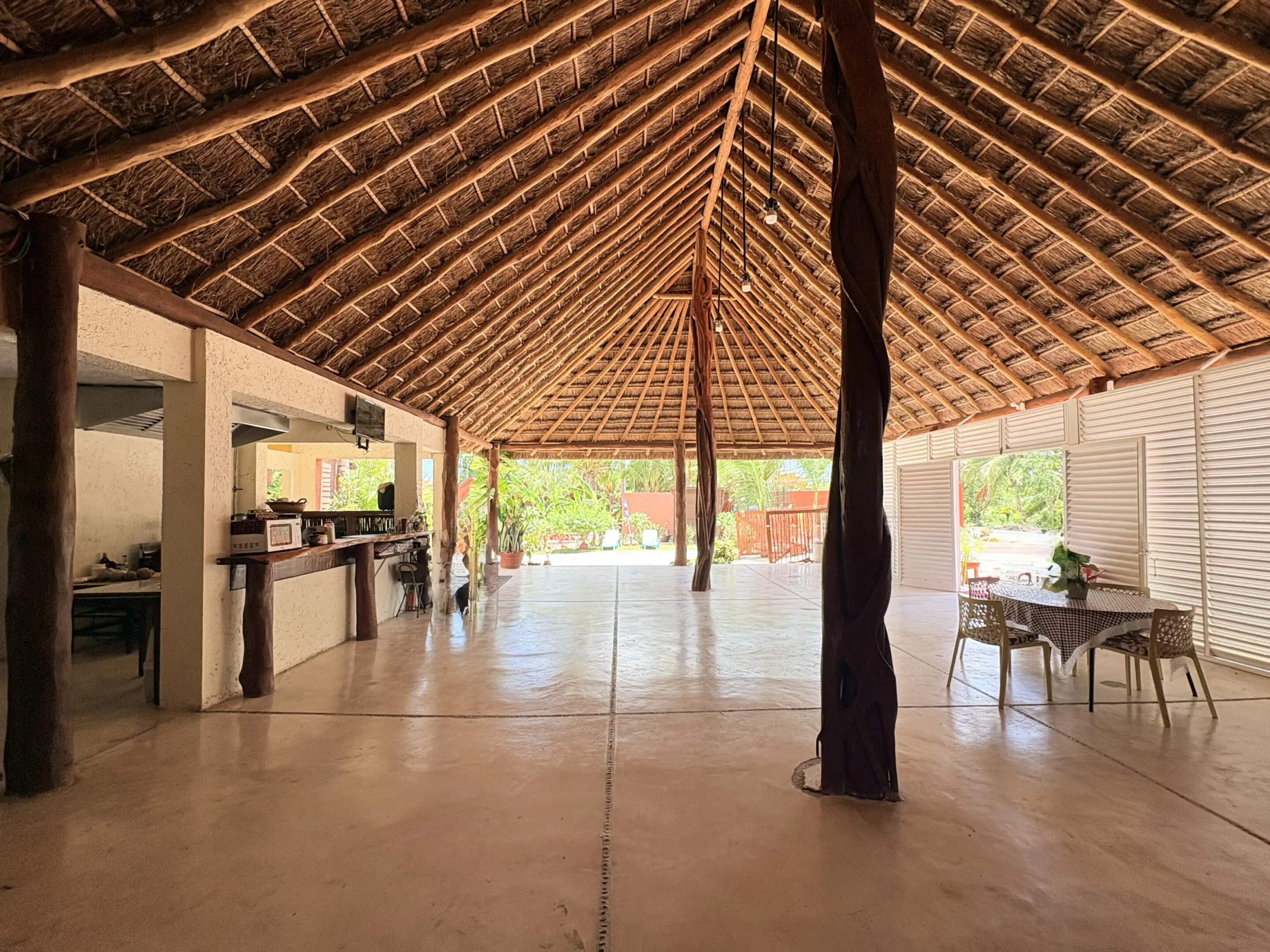 Spacious open-air thatched-roof dining pavilion