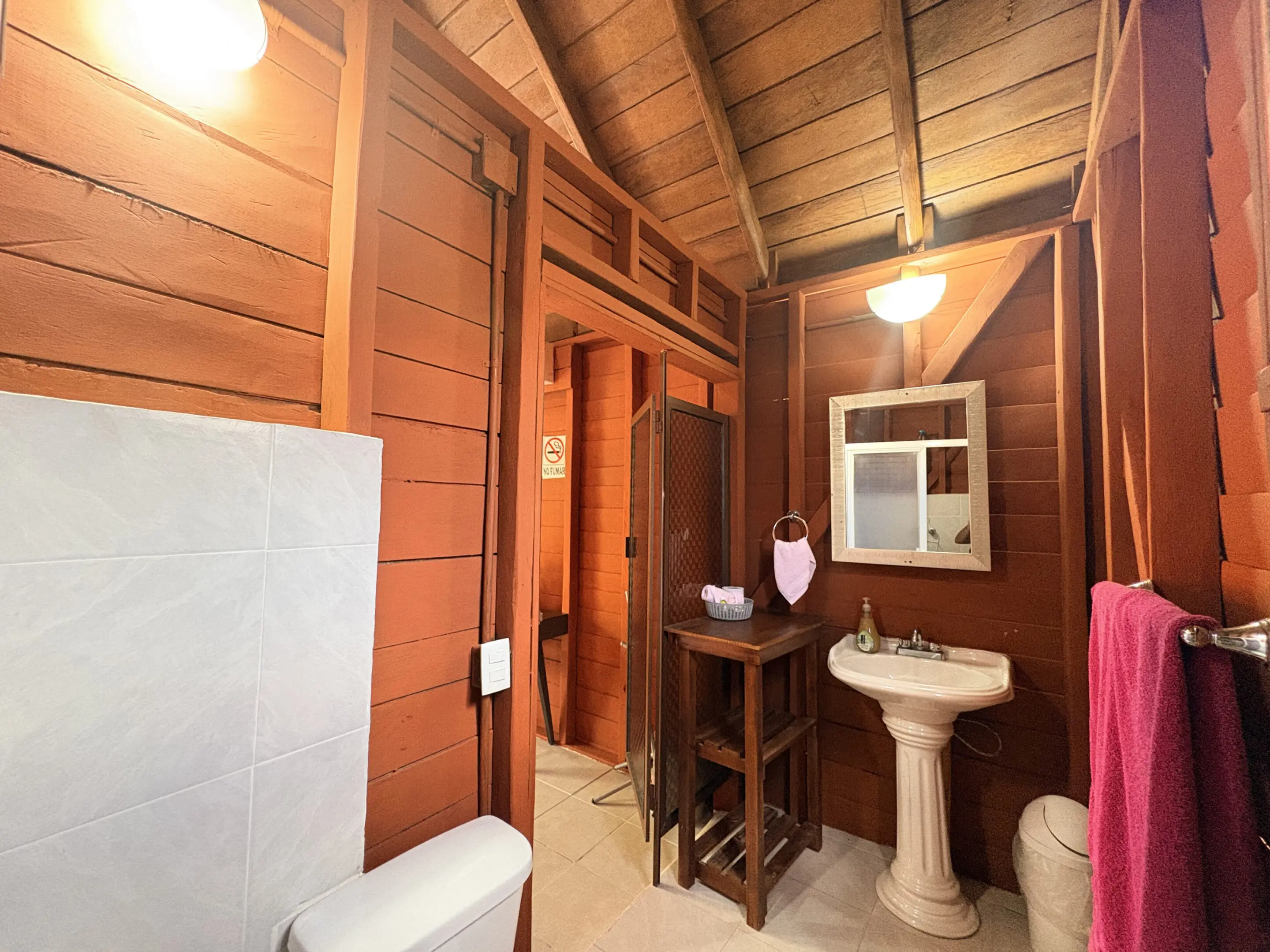 Rustic cabin bathroom with pedestal sink