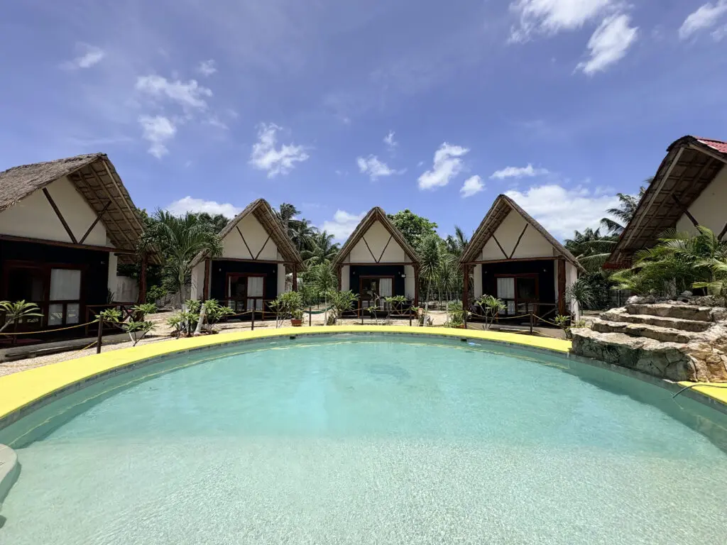 Tropical resort bungalows by swimming pool