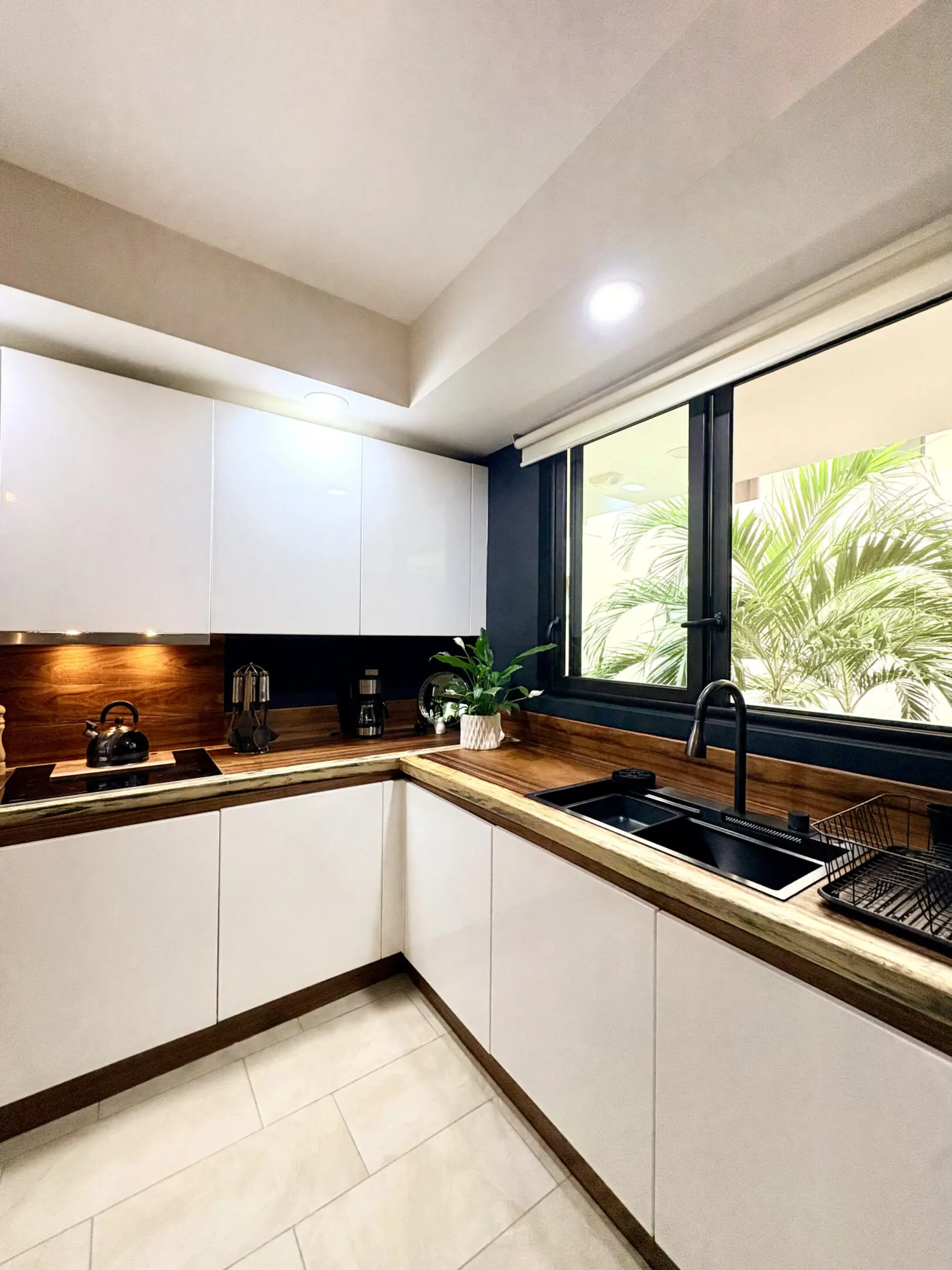 Modern L-shaped kitchen with wood countertops