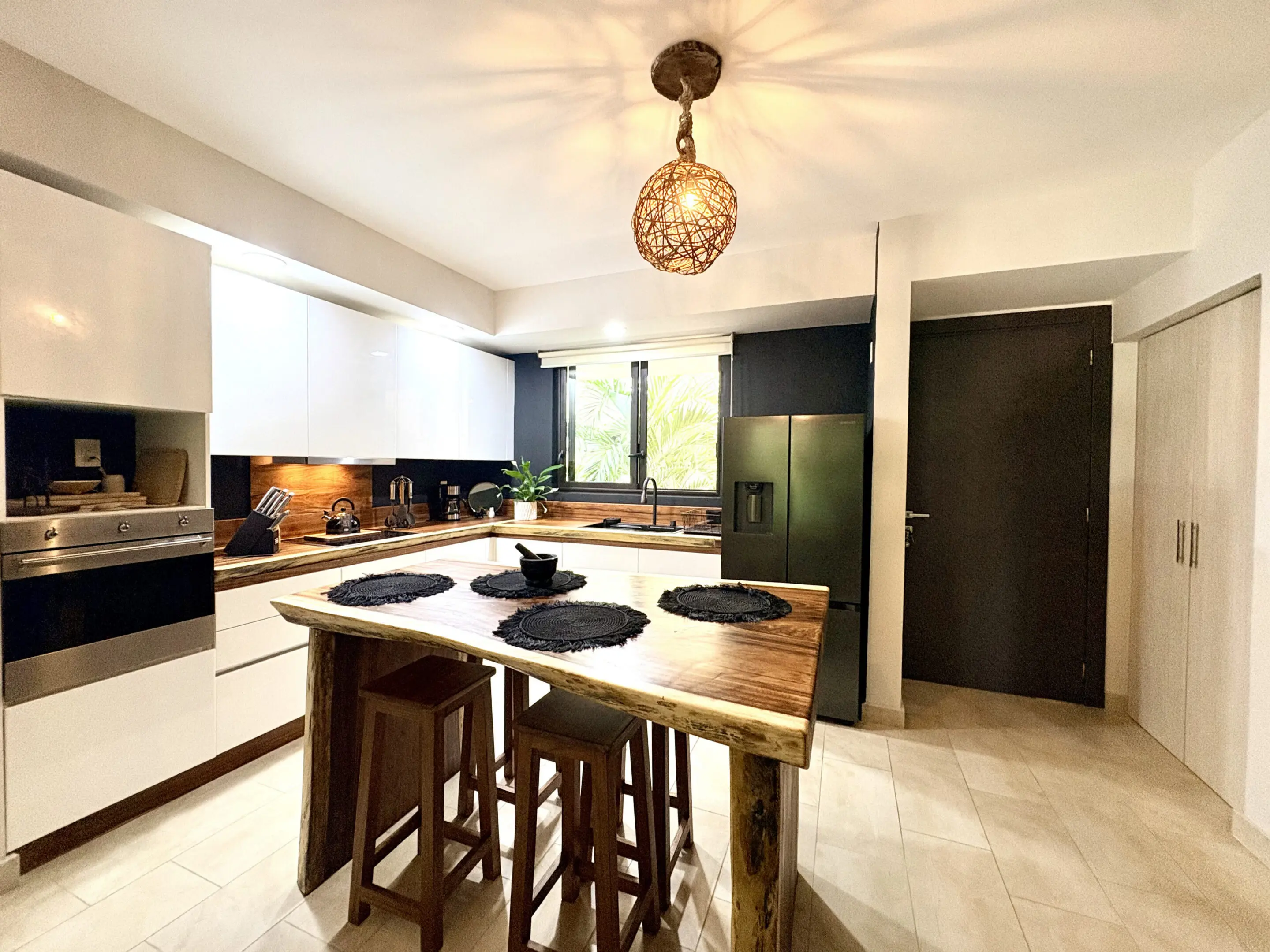 Modern kitchen with wooden island and stools