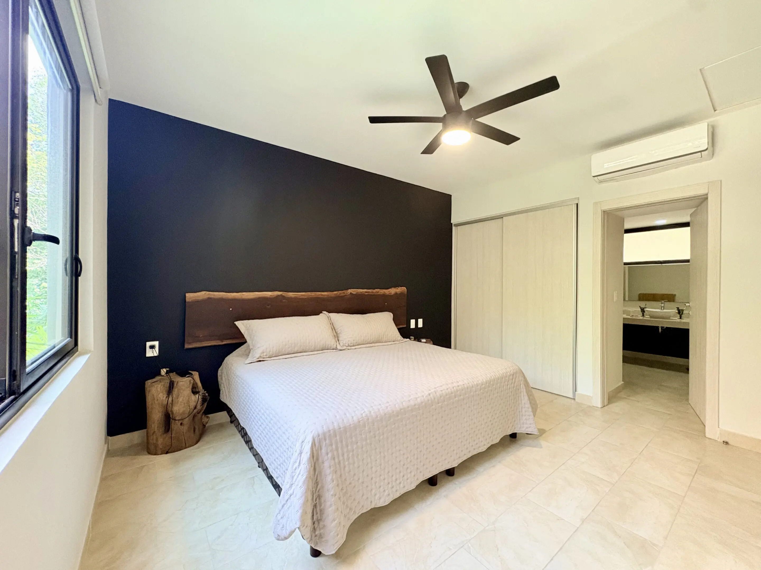 Modern bedroom with dark accent wall