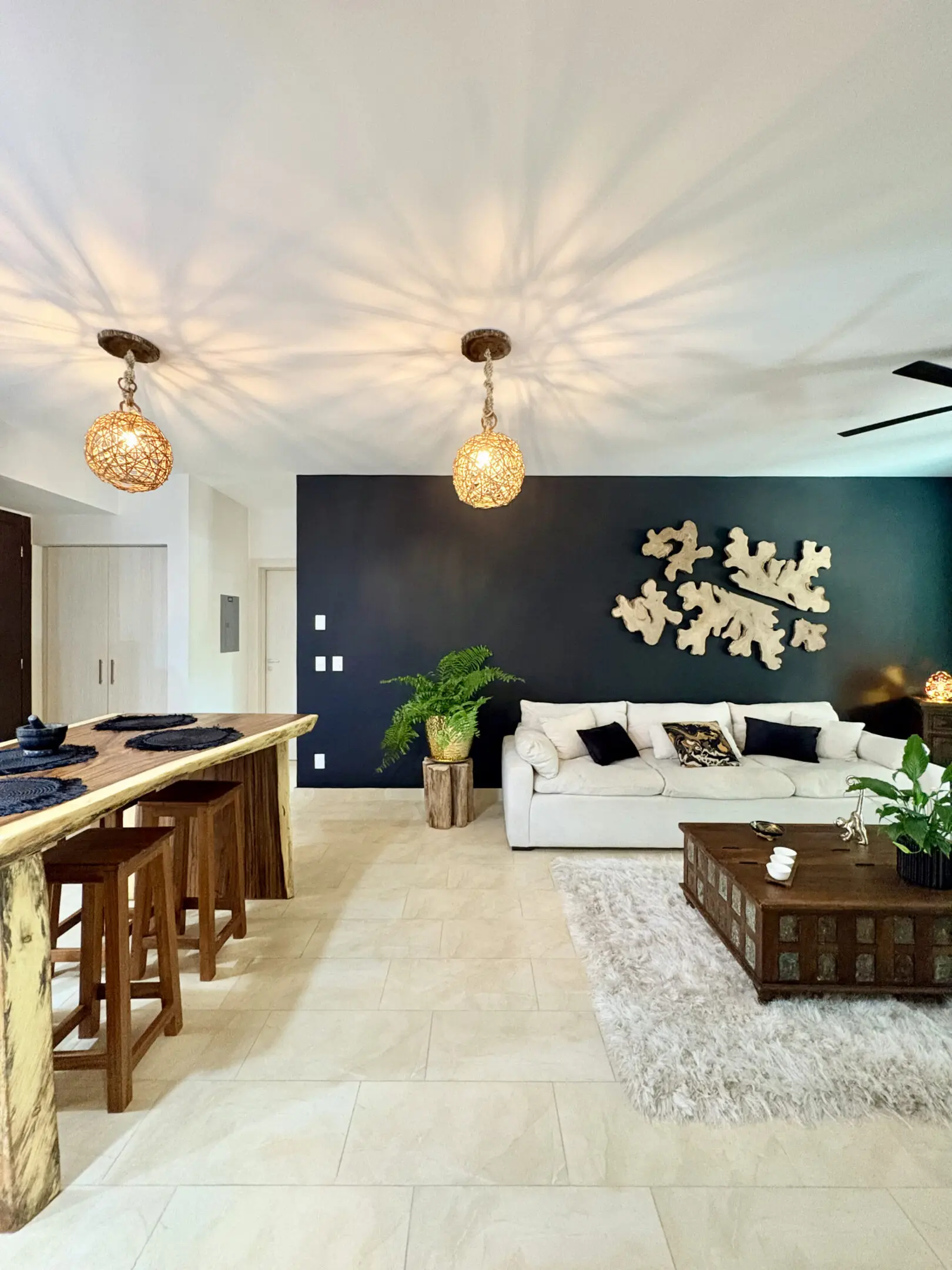Open modern living room with pendant lights