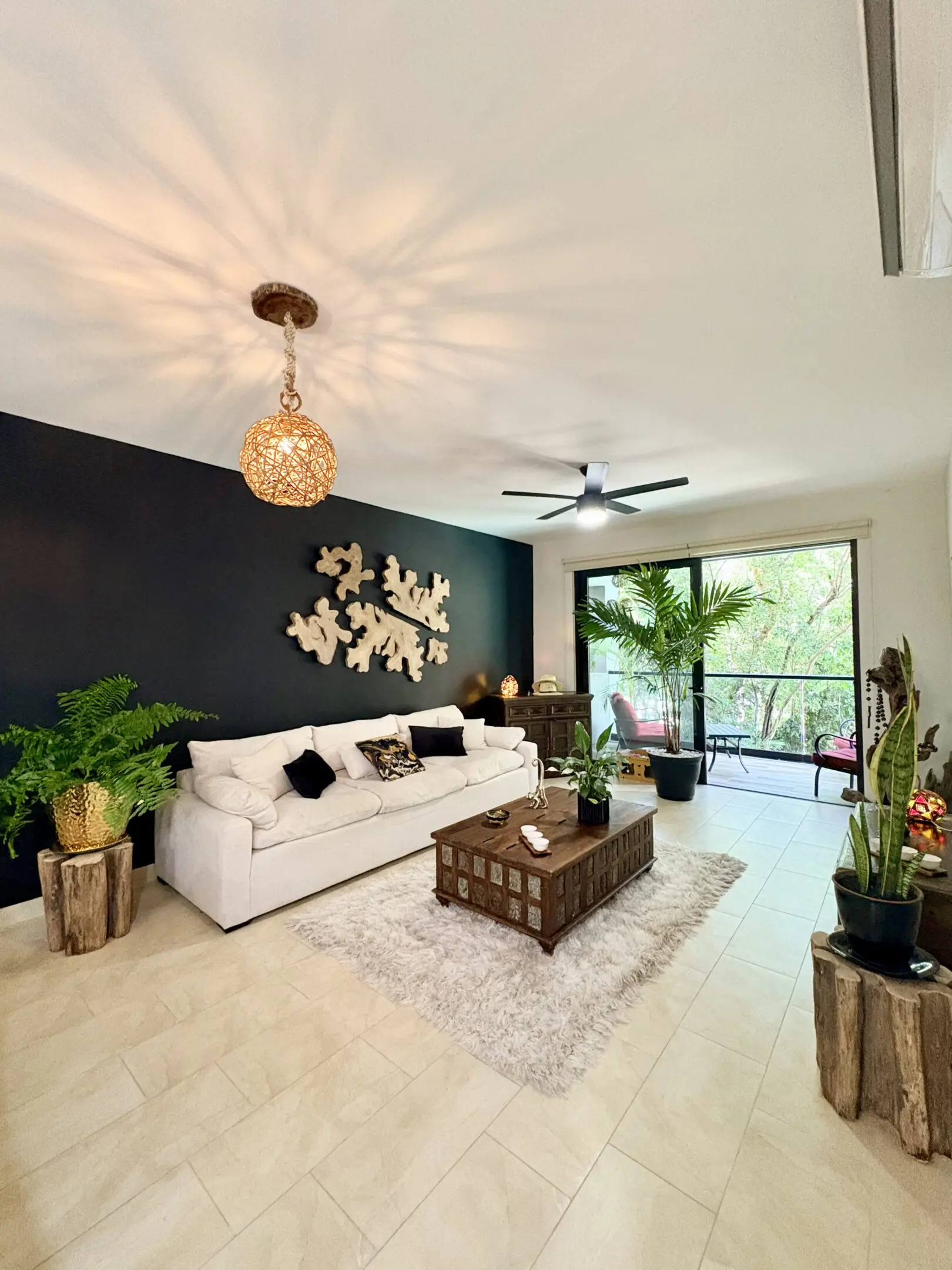 Modern living room with white sofa and plants