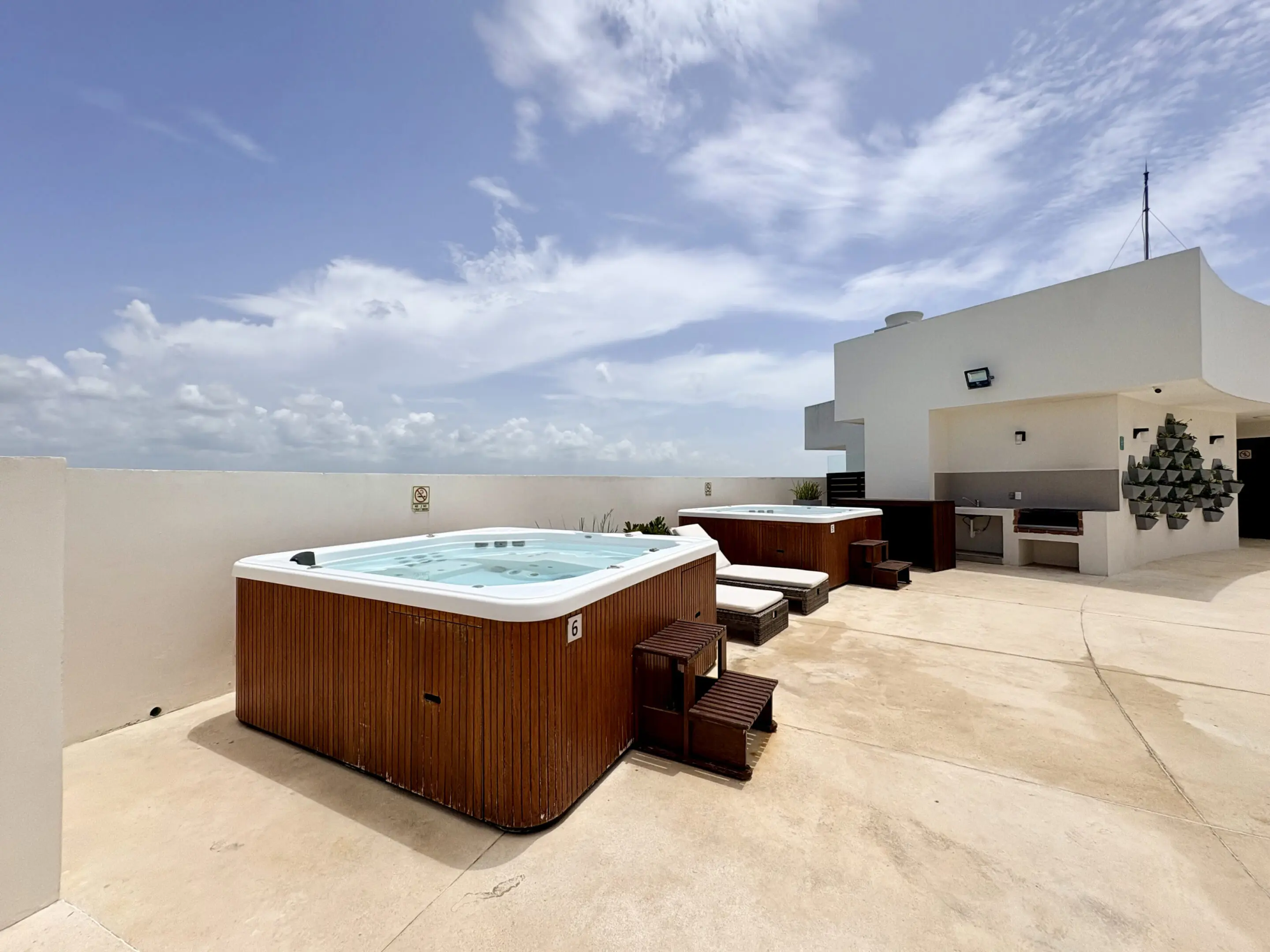 Rooftop terrace with hot tubs and seating
