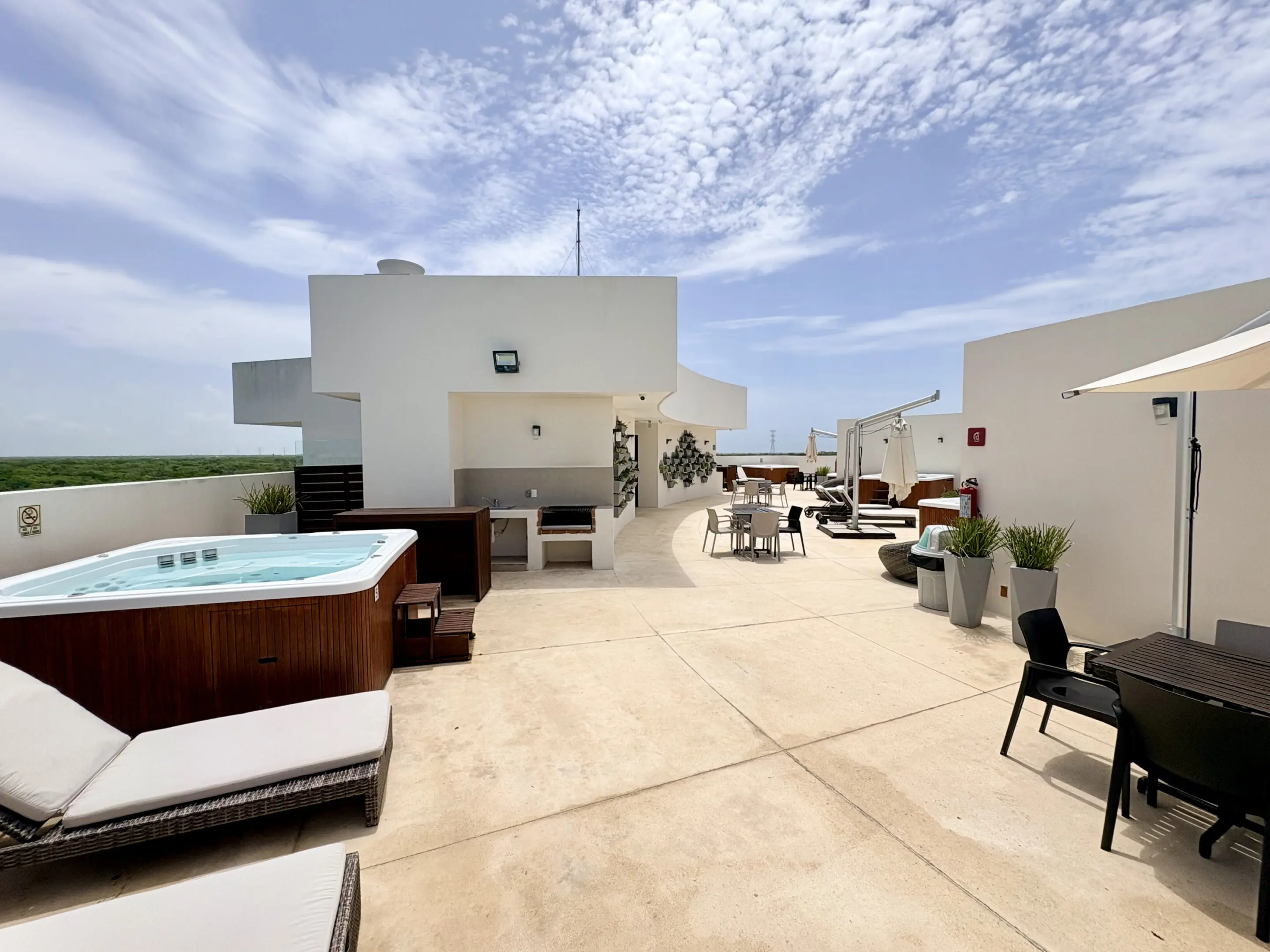 Rooftop terrace with hot tub and seating