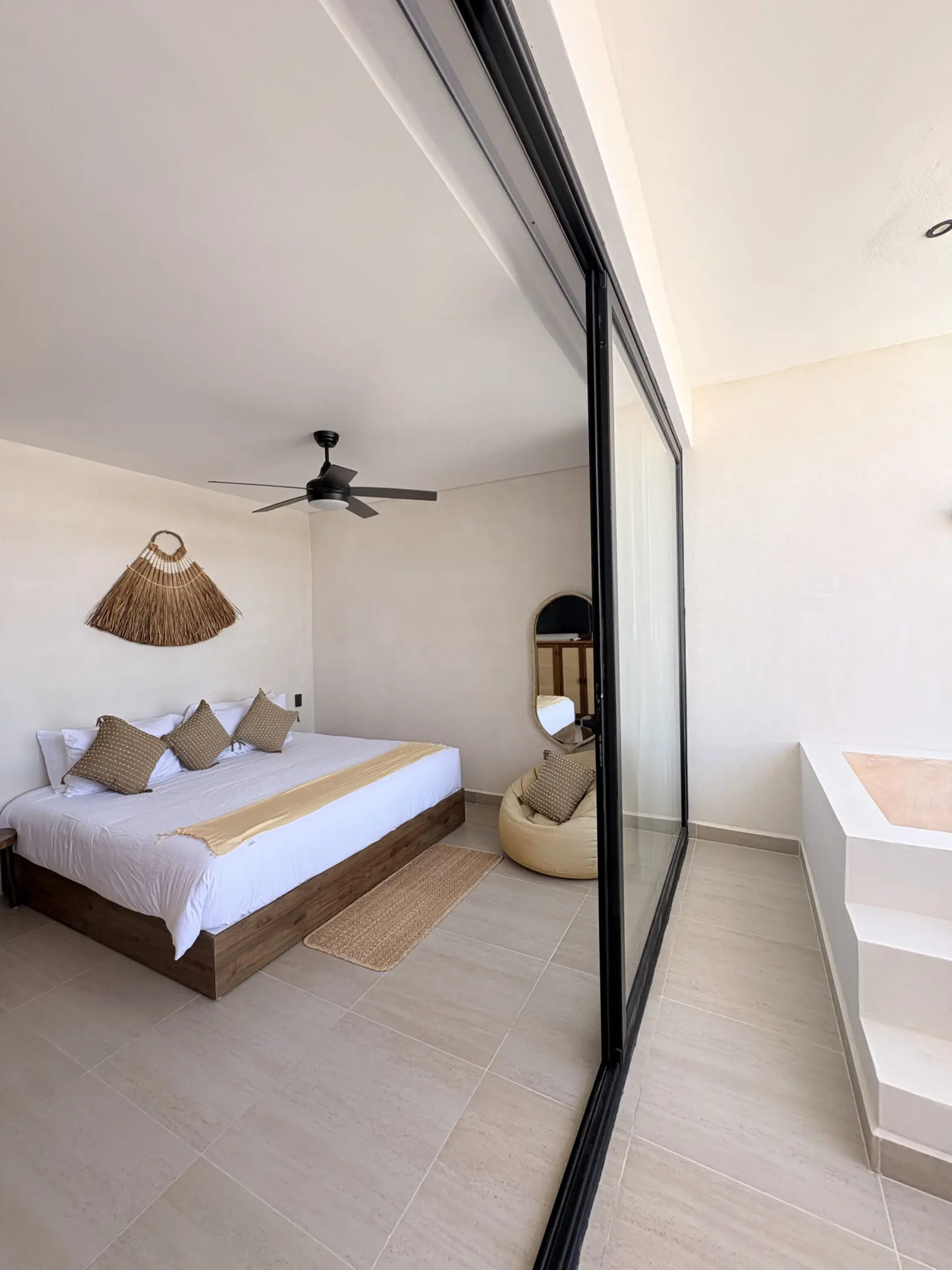 Modern minimalist bedroom with sliding glass doors