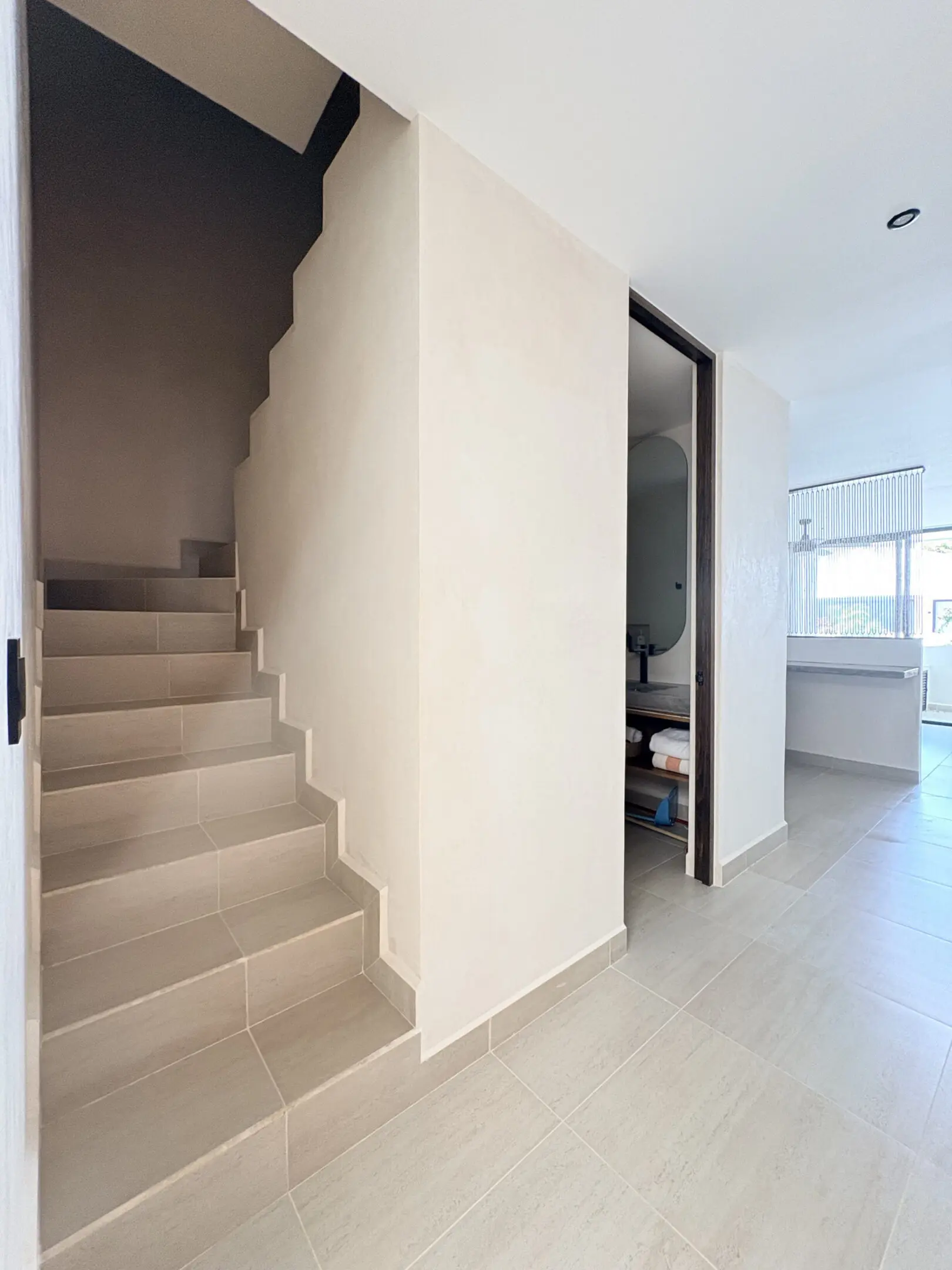 Minimalist modern home interior with staircase