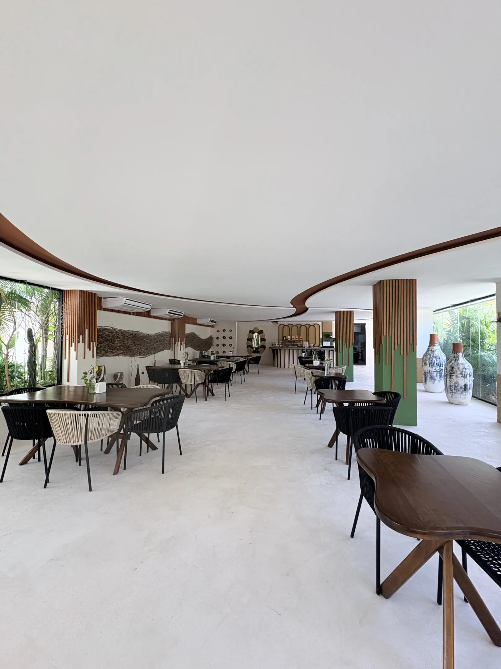 Modern restaurant interior with wooden tables