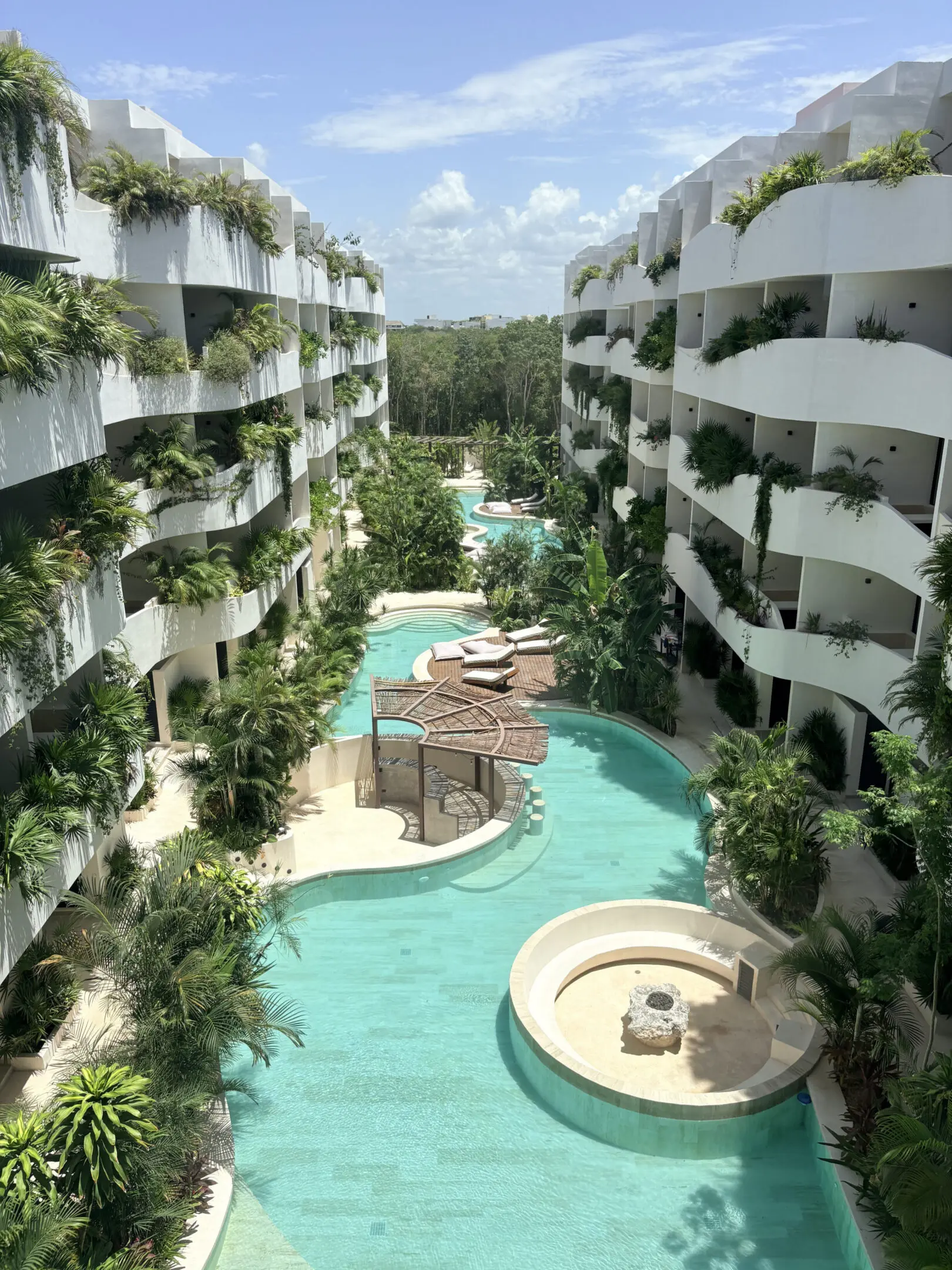 Aerial view of tropical resort pool courtyard