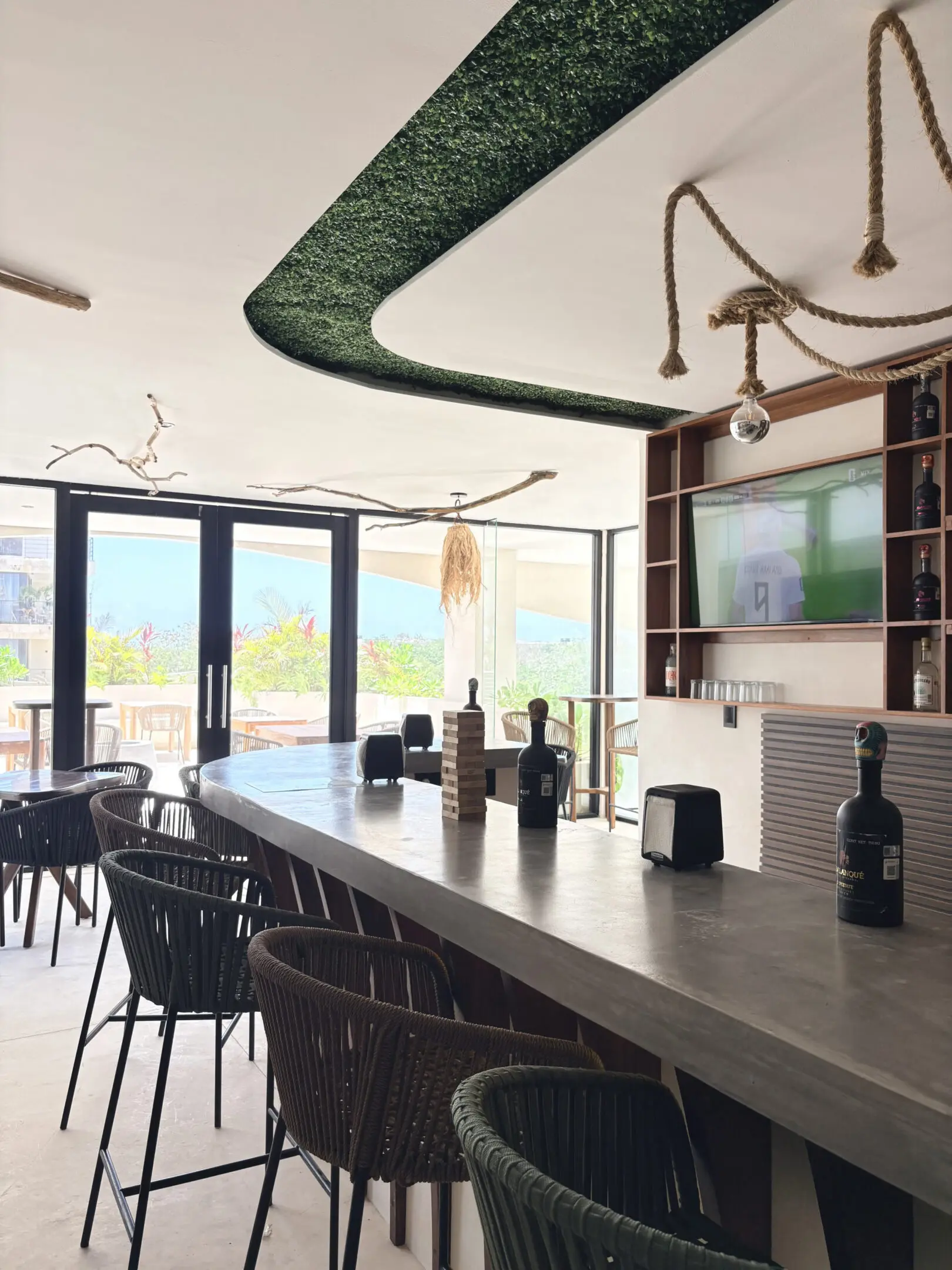 Modern bar interior with long counter and stools