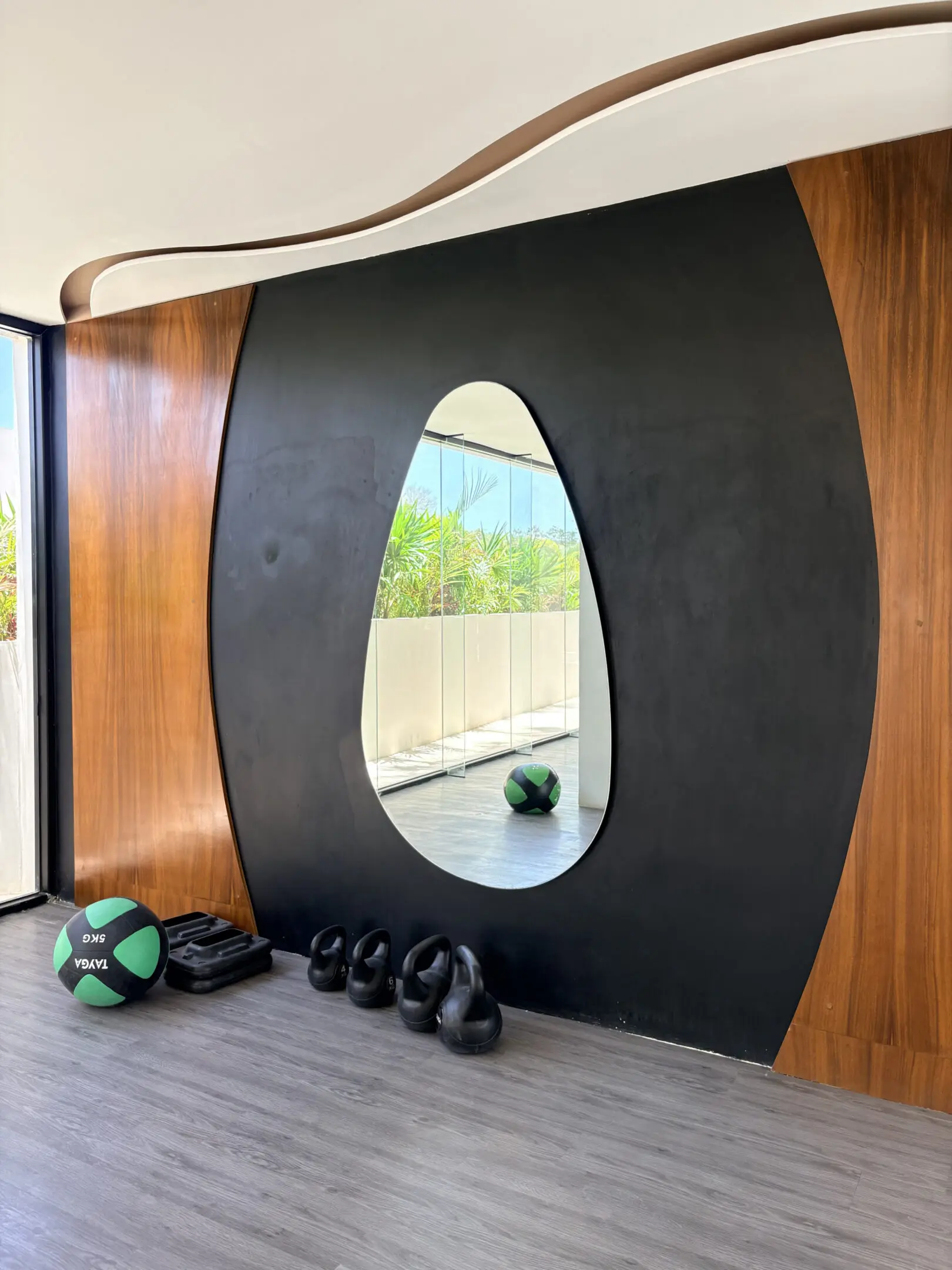 Gym corner with mirror and kettlebells