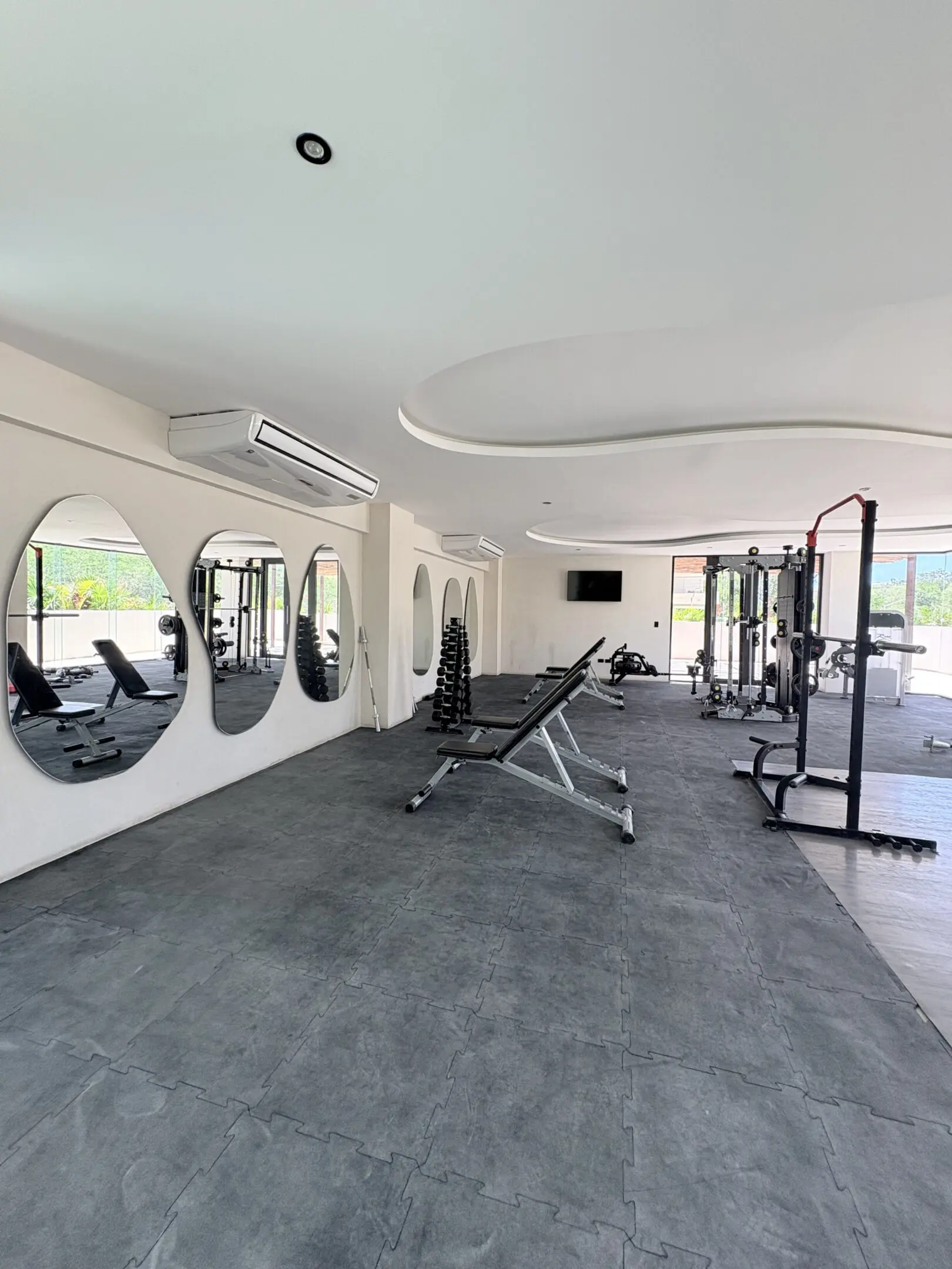 Modern bright gym with workout equipment