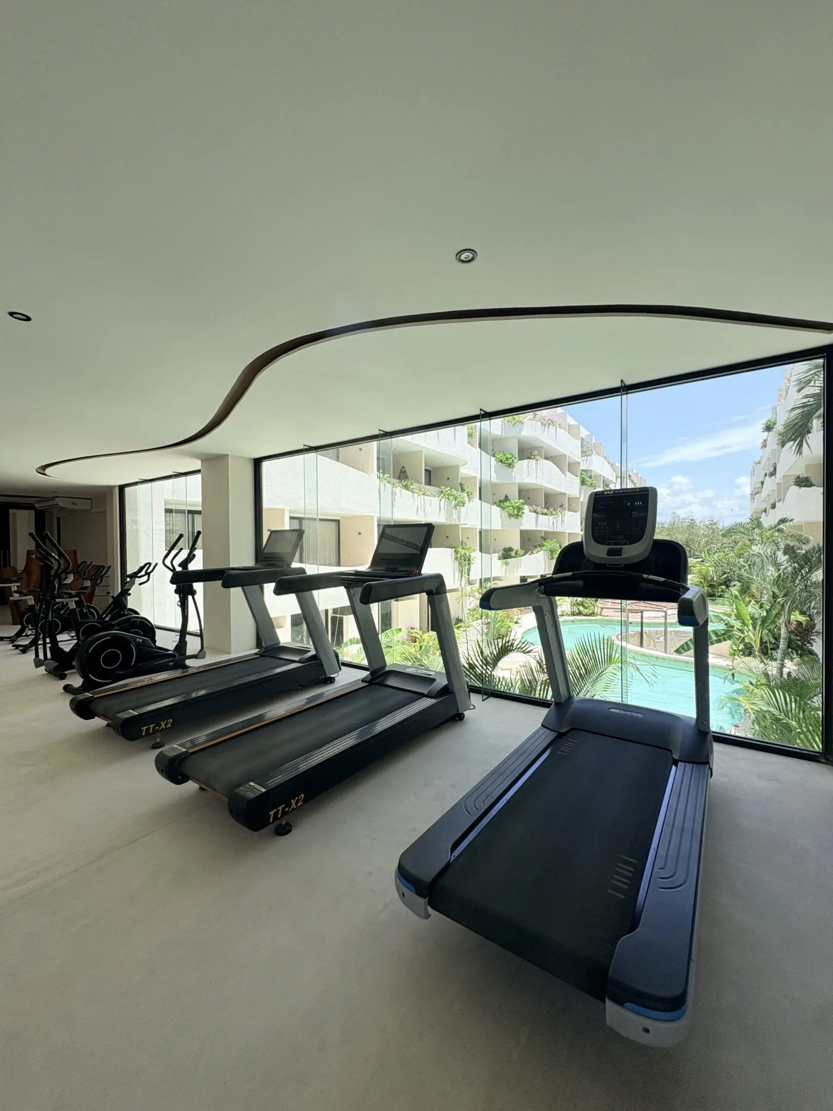 Treadmills in gym with pool view
