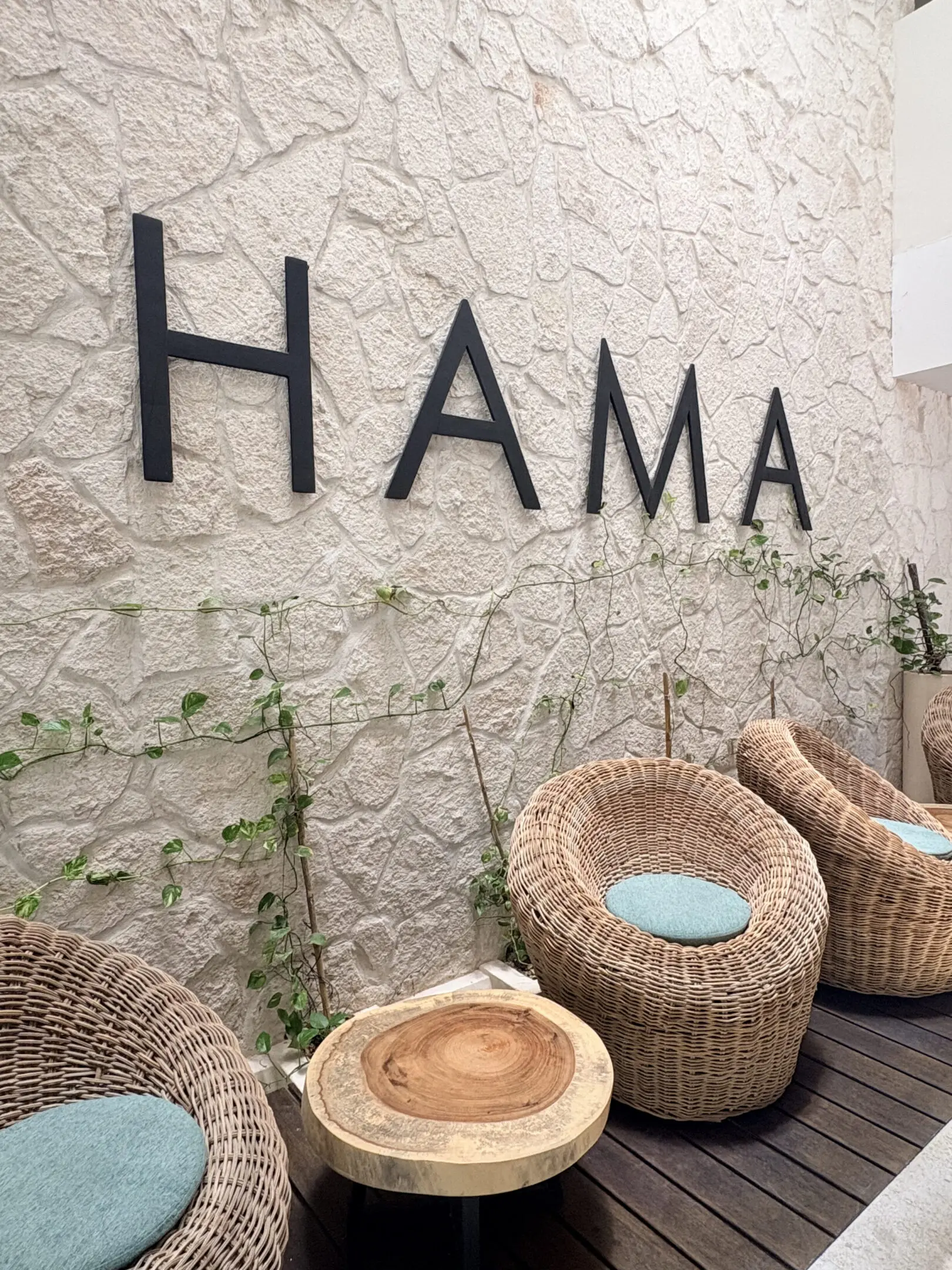 Wicker lounge chairs and HAMA wall sign
