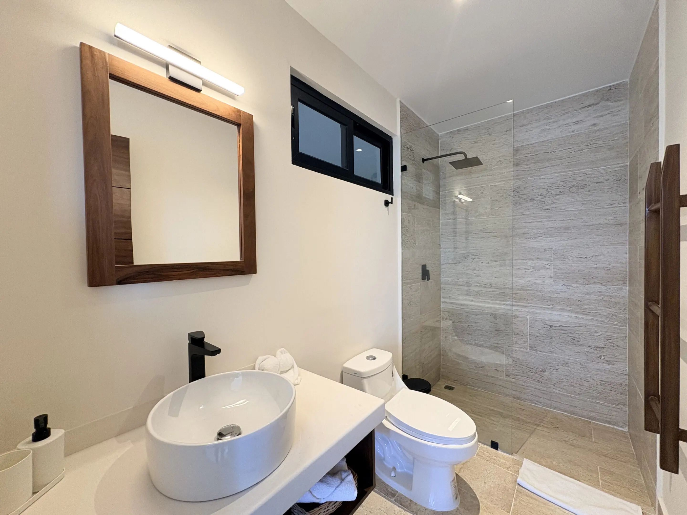 Modern bathroom with vessel sink and shower
