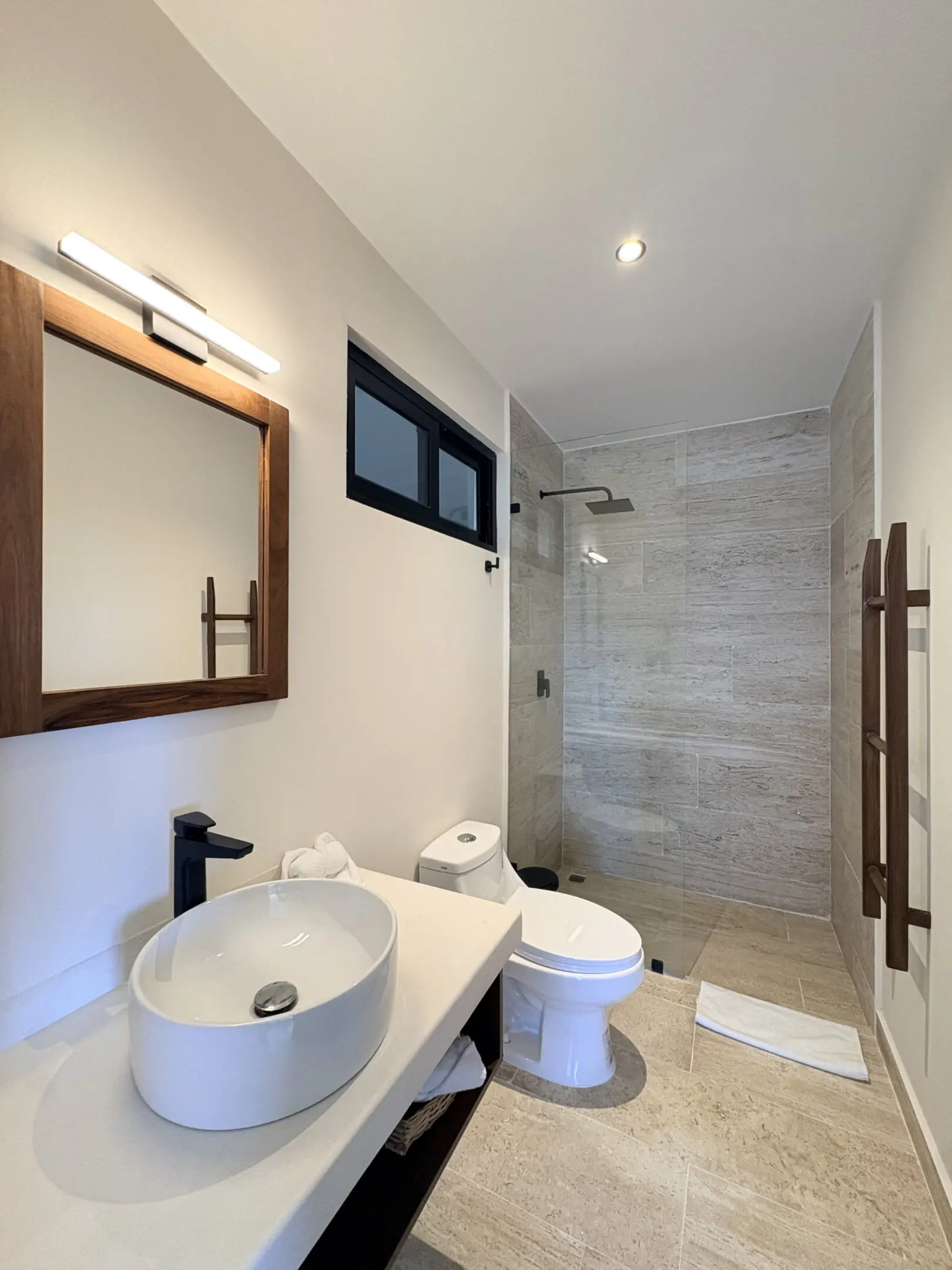 Modern bathroom with vessel sink and shower