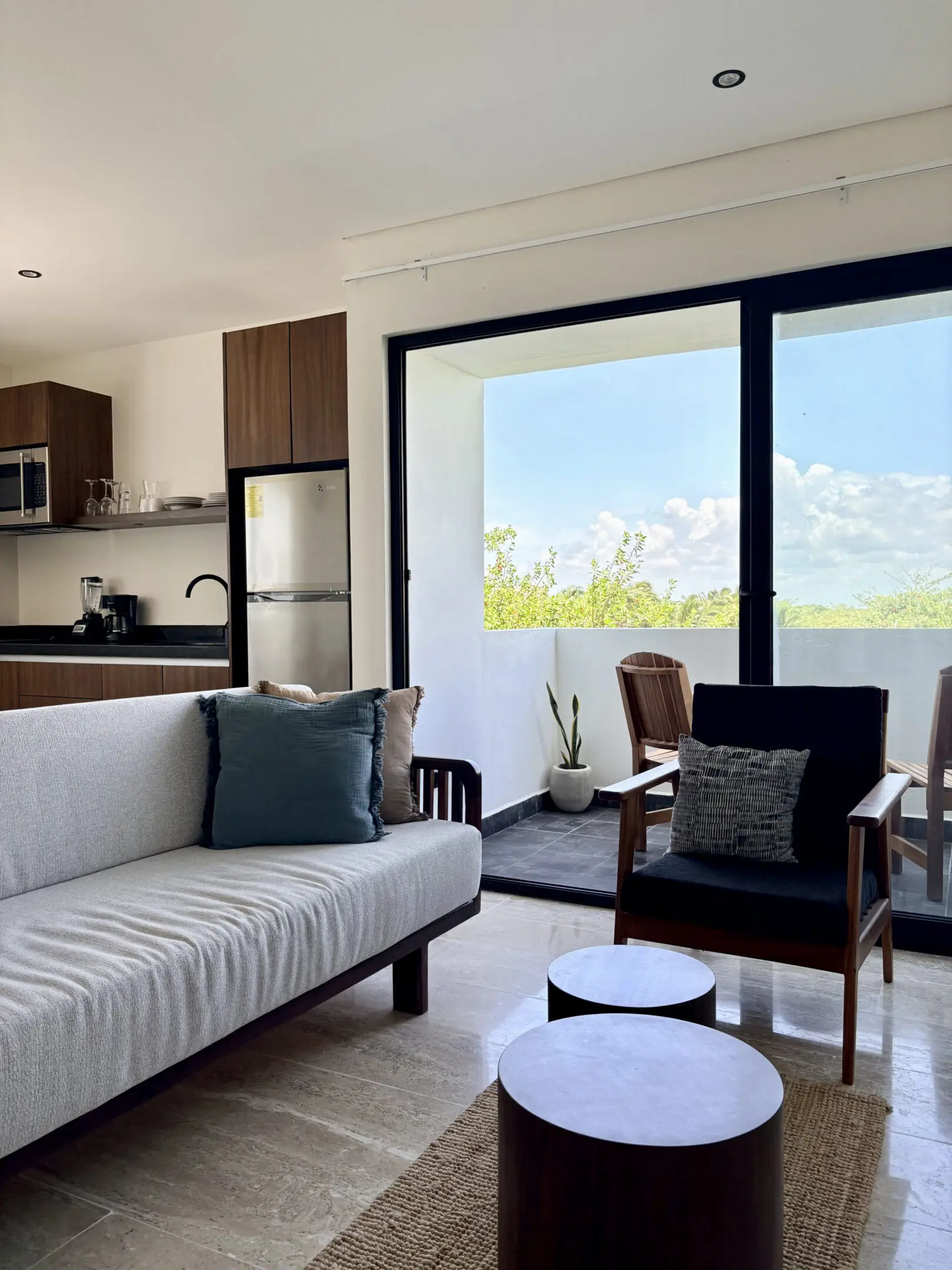 Modern living room with balcony and scenic view
