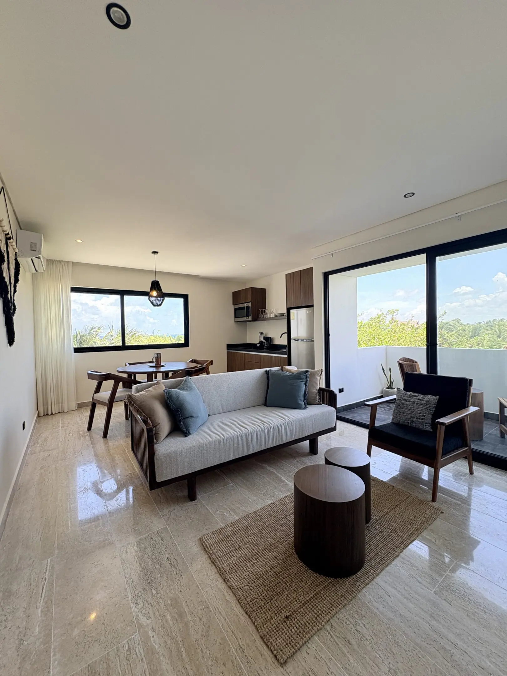 Modern living room with balcony and dining