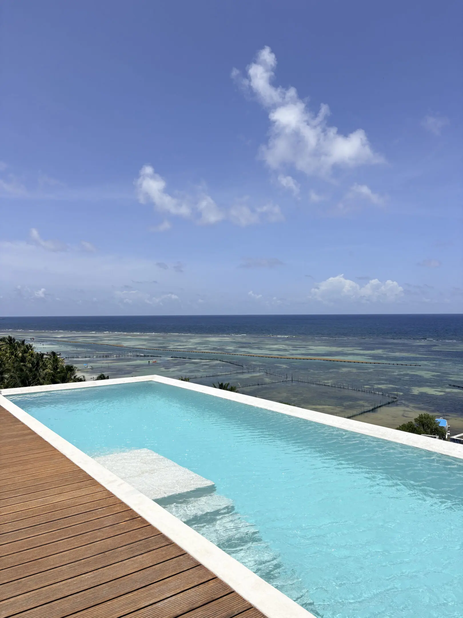 Infinity pool overlooking turquoise ocean and sky