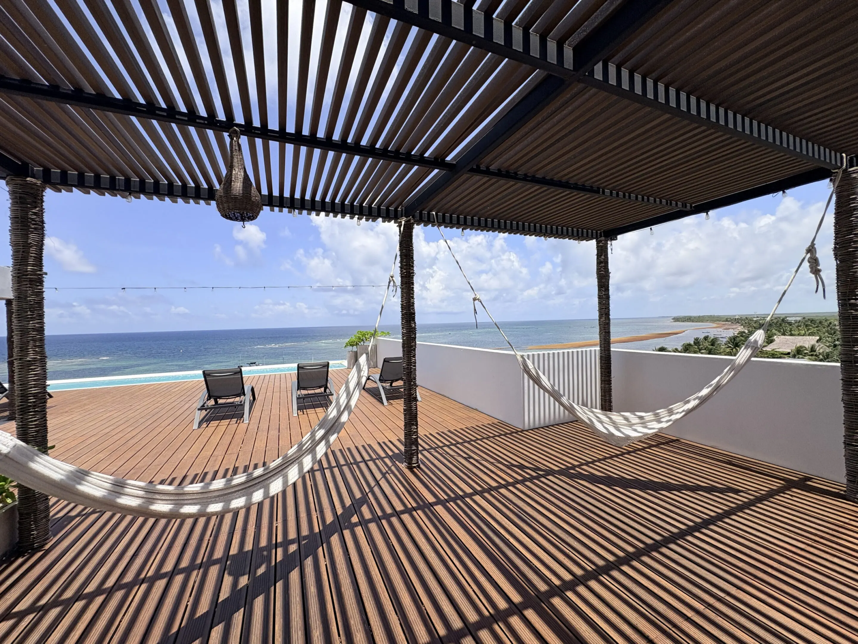 Oceanfront pergola deck with hammocks