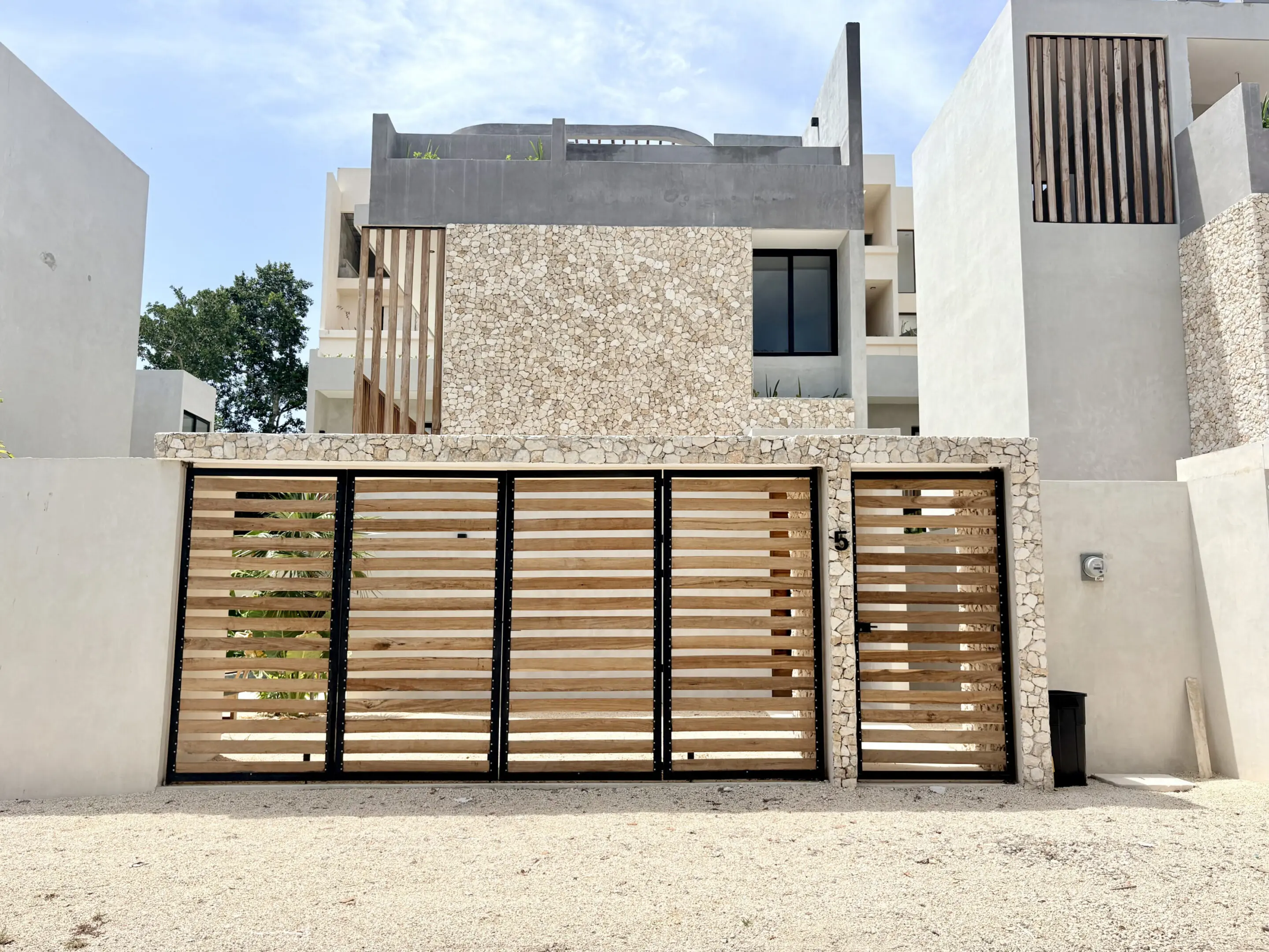 Modern villa with wooden slatted gate
