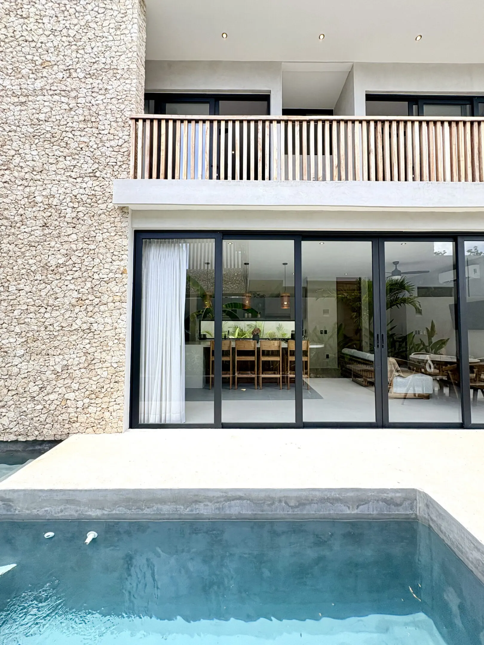 Modern house with pool and sliding glass doors